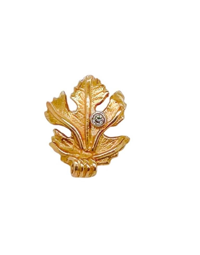 Small Vine Leaf stud earrings made in 18ct yellow gold with brilliant diamond accent on each.
