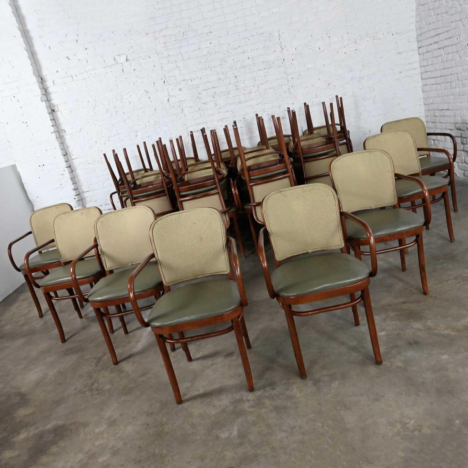 Wonderful vintage Bauhaus oak bentwood Josef Hoffman Prague 811 armchairs by Thonet. We have 22 and we are selling them separately. One chair has a different fabric on the seat back. Beautiful condition, keeping in mind that these are vintage and