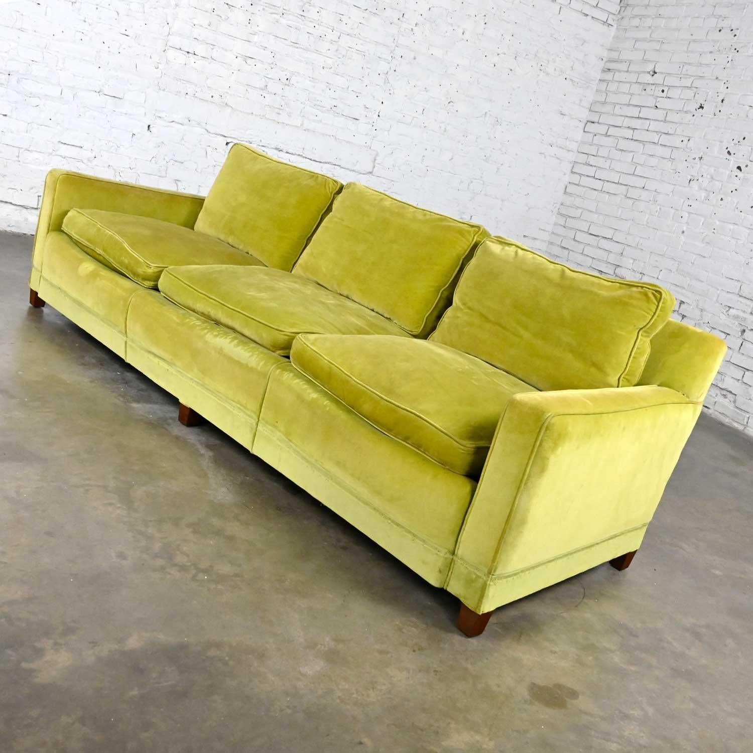 Gorgeous vintage mid-century modern chartreuse green velvet Lawson style sofa with squared tapered wood legs, feather down back cushions, and feather down wrapped spring seat cushions. Beautiful condition, keeping in mind that this is vintage and