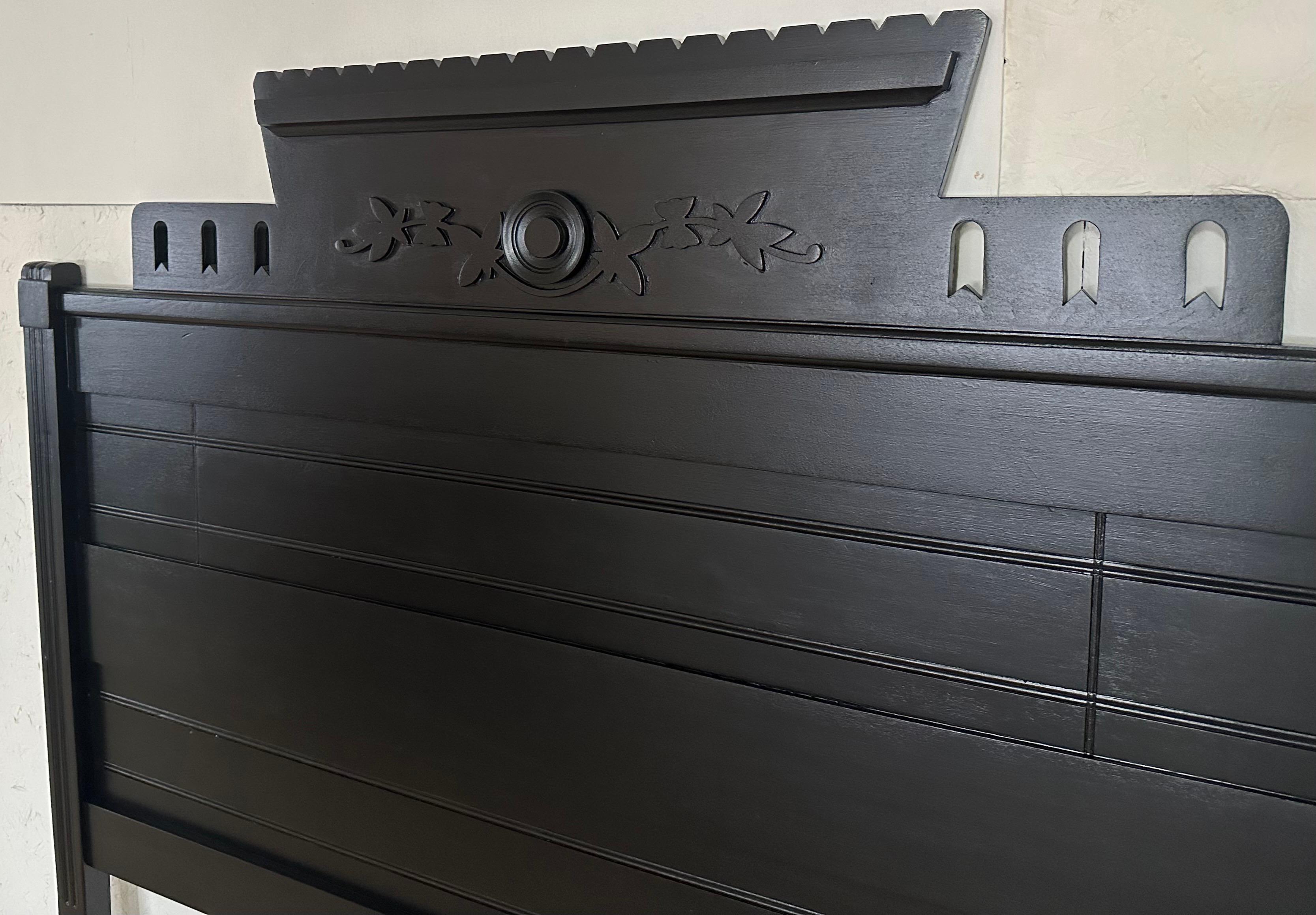 A wonderful example of an American Victorian period Arts & Crafts style furniture. This one a full size double walnut headboard, painted a soft black, the headboard has been raised to 56