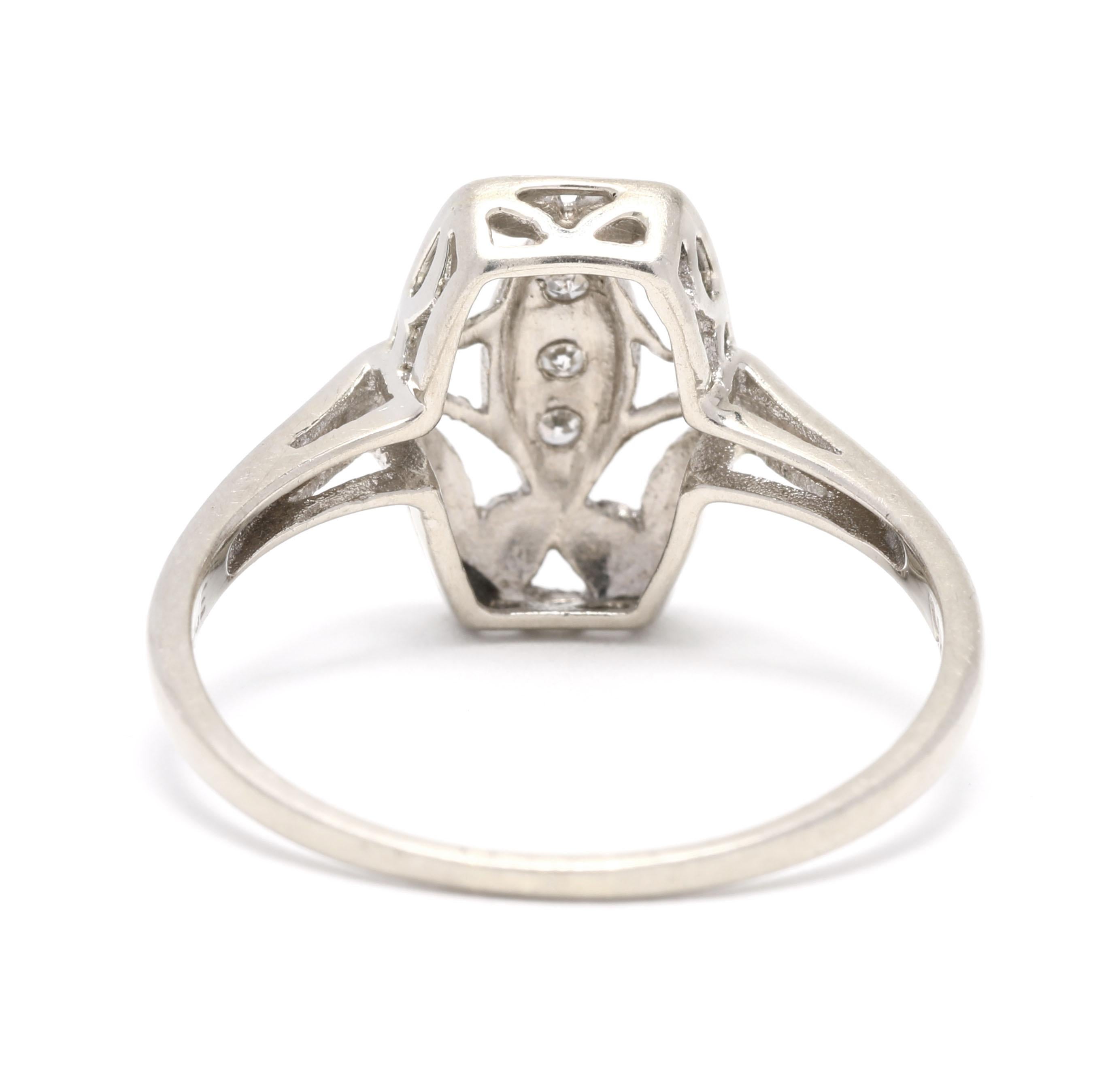 This stunning vintage diamond ring features a 0.03ctw marquise-cut diamond navette set in 14k white gold. Crafted in the 1950s, this exquisite cocktail ring is sure to make a statement. The diamond is set in a milgrain-edged bezel, surrounded by a
