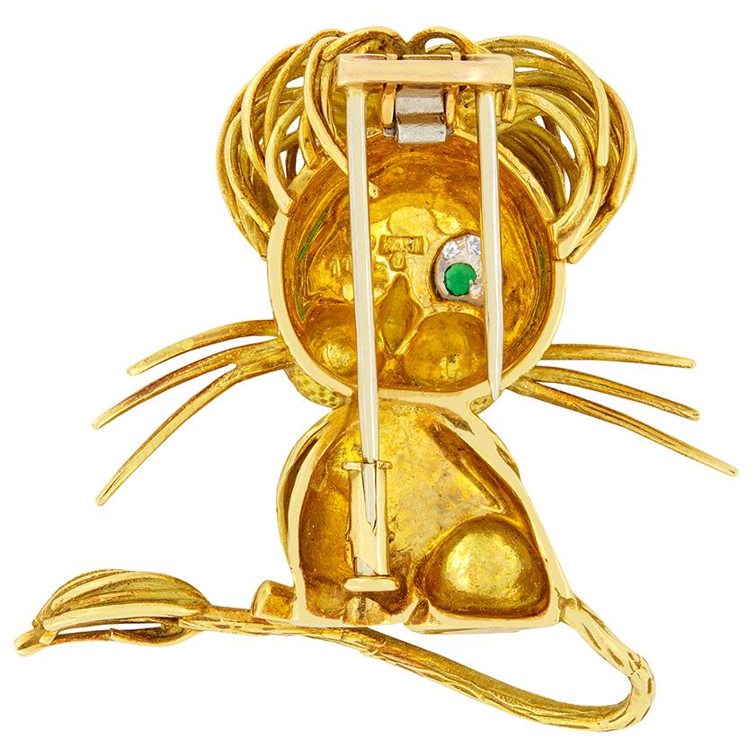 A fun and quirky brooch in the form of a lion, dating back to 1970s. Strands of gold are strategically placed to create the lions unruly mane as well as its whiskers and the end of its tail. Adding to the quirkiness of this vintage brooch is the