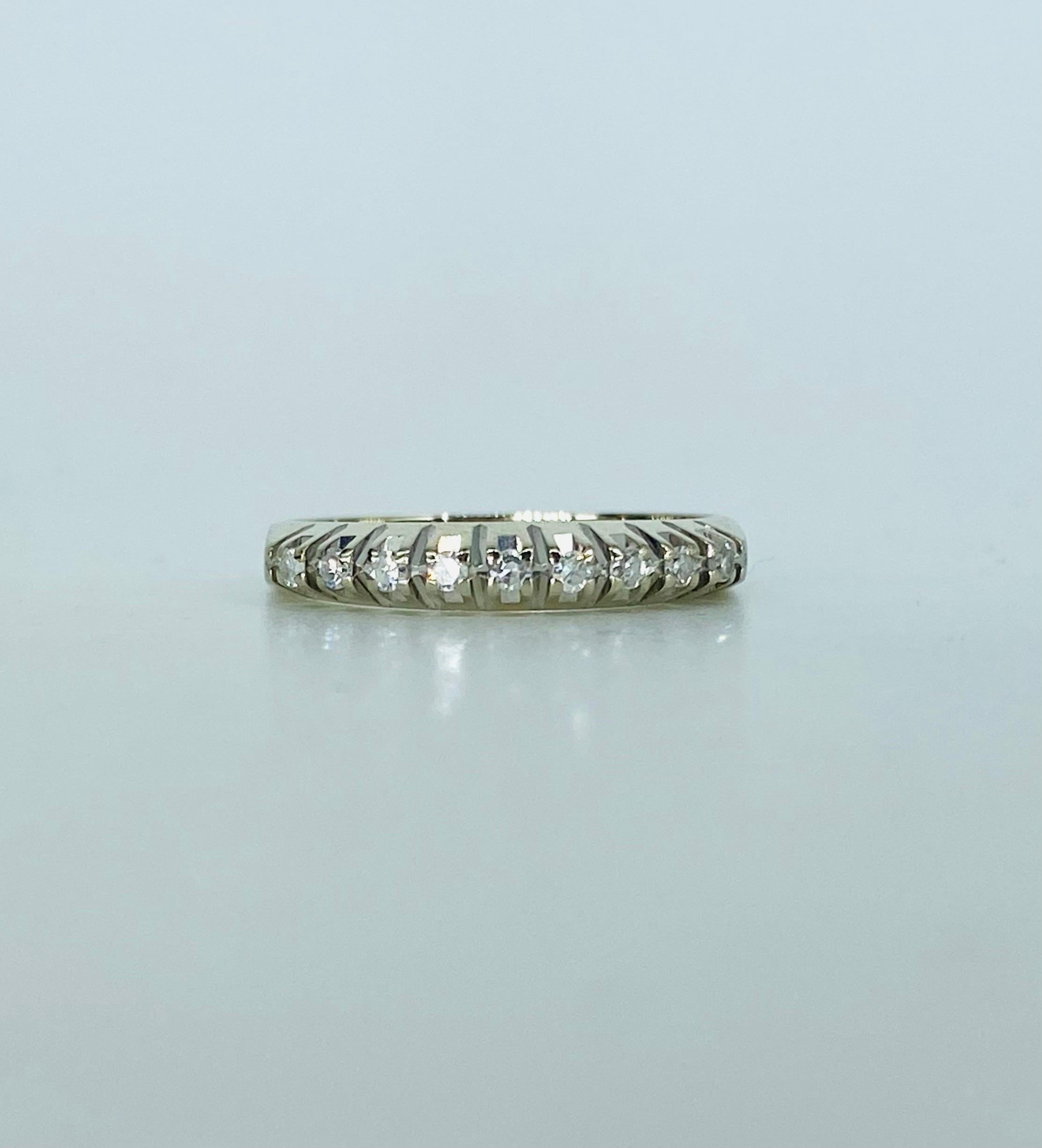 Vintage 0.13 Carat Diamonds Half Eternity Ring 18k White Gold. Very nice and unique design the way the diamonds are set. There are 9 round diamonds each weighting approx 0.015ct each for a total of 0.13 carat. The diamonds Brings out more brilliance