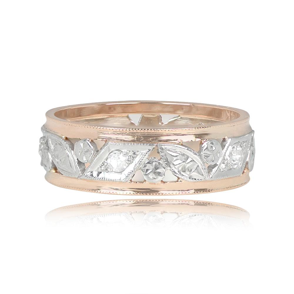 A Retro two-tone leaf motif eternity band, adorned with single-cut diamonds set inside geometric bezels, totaling approximately 0.13 carats. Handcrafted in 14k yellow and white gold circa 1940, the band has a width of approximately 6.1mm and is size