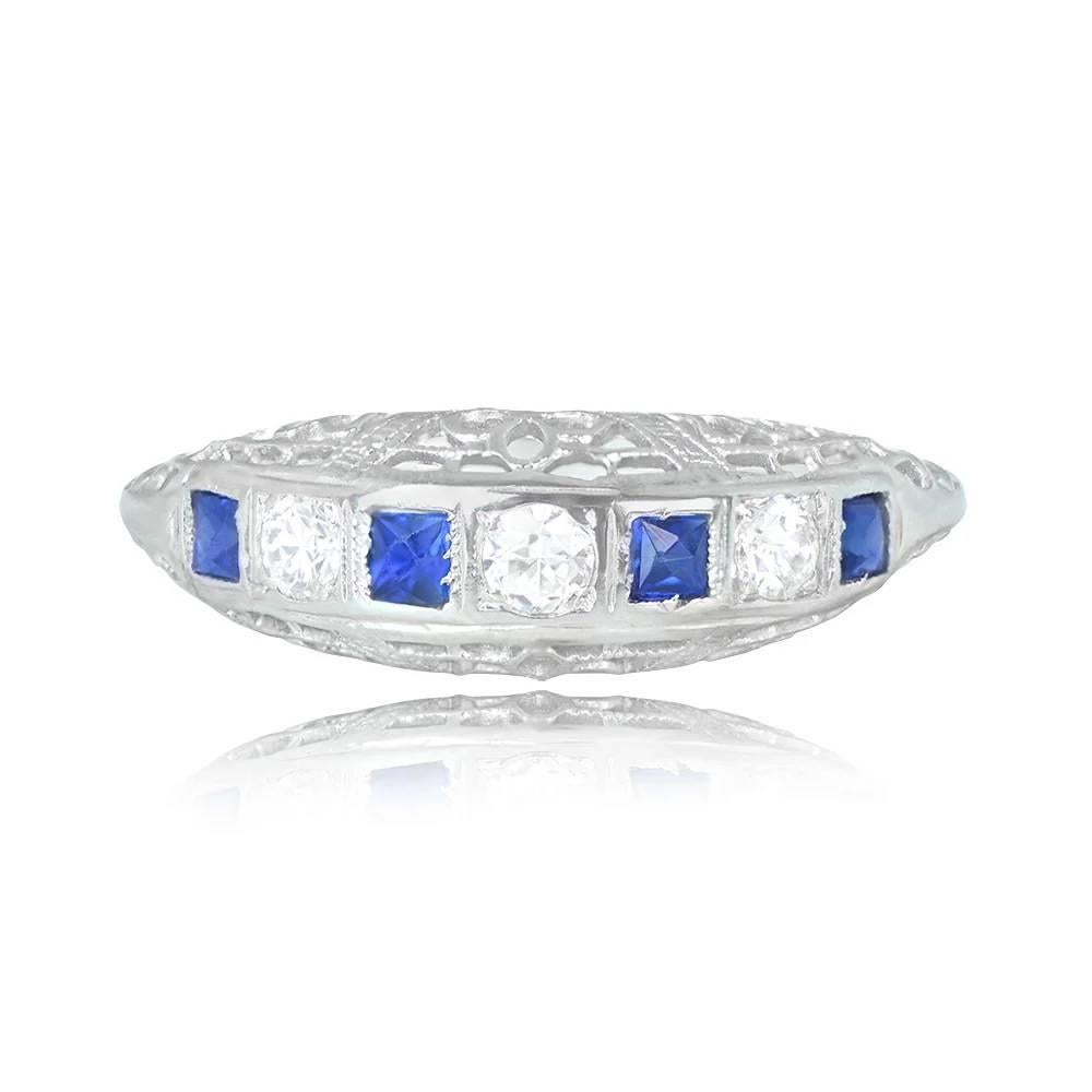 A vintage half-eternity wedding band featuring alternating old European cut diamonds and French cut sapphires, with a total diamond weight of around 0.19 carats and a total sapphire weight of approximately 0.16 carats. The under-gallery showcases