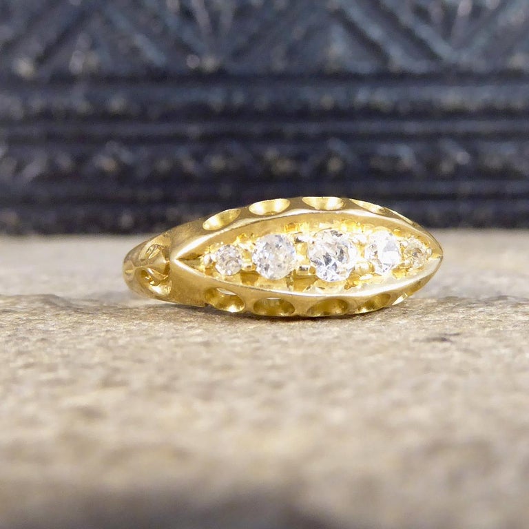 Such a lovely antique style boat ring has been hand made to resemble a style from the Edwardian era with very faded older hallmarks on the inner band and clear later hallmarks. The ring has five Old European Cut Diamonds totalling 0.20ct and