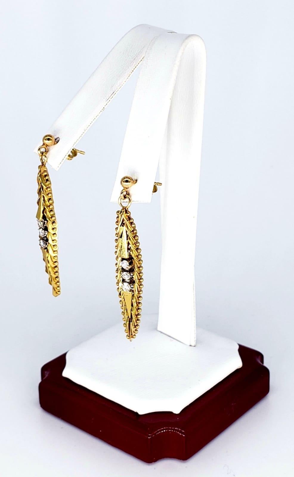 Vintage 0.24 Carats Drop Earrings 14k Gold. These earrings are a true masterpiece The way they were designed and made. The earrings feature both yellow gold & white gold. These earrings stand out in the crowd and have a bright dangling shine to them