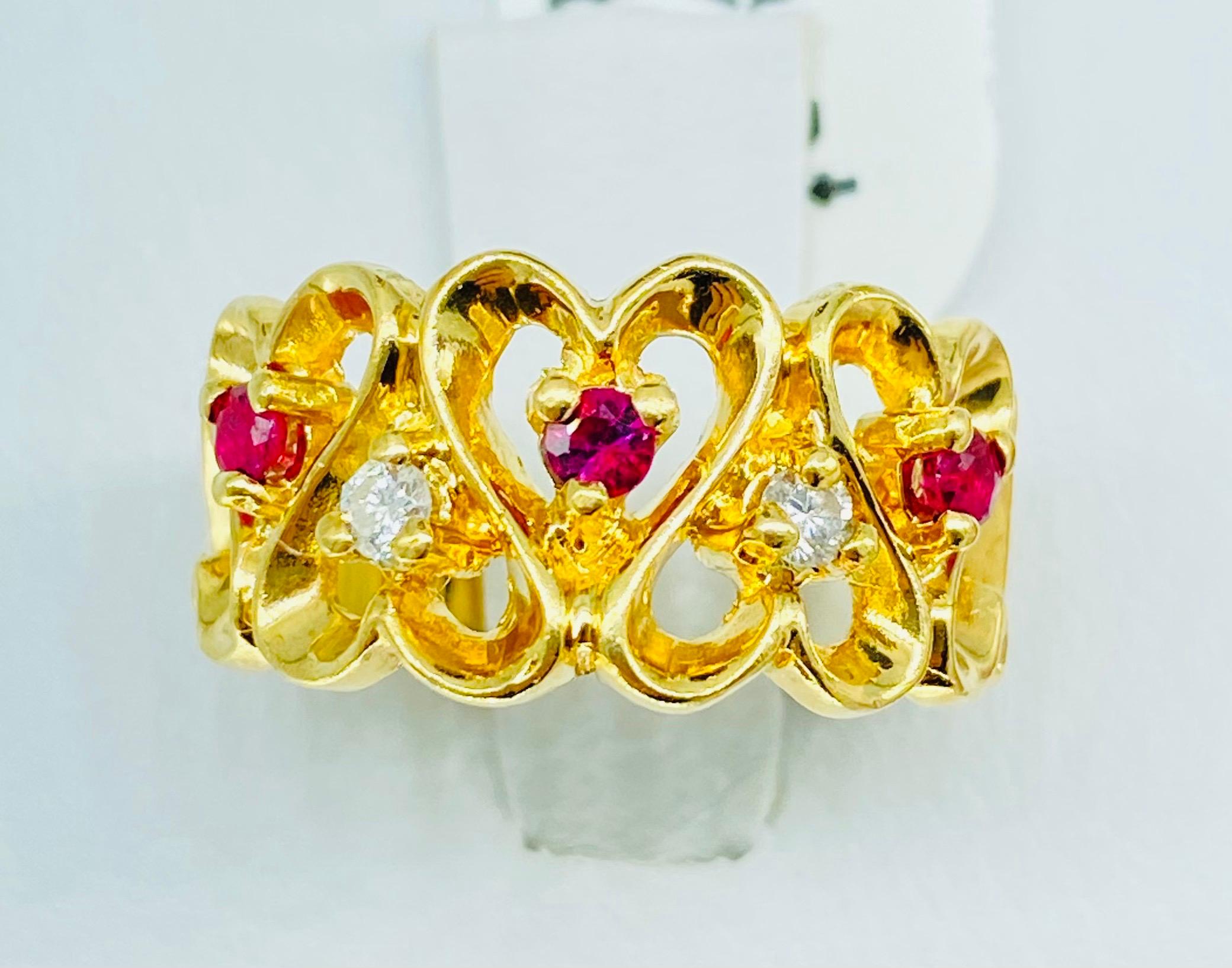 Vintage 0.25 Carat Ruby & Diamond Connected Heart Ring 14k Gold. Beautiful design throughout very high quality details showing hearts connecting with diamonds and ruby gemstones in the center of each heart. The ring features 0.25 total carat weight