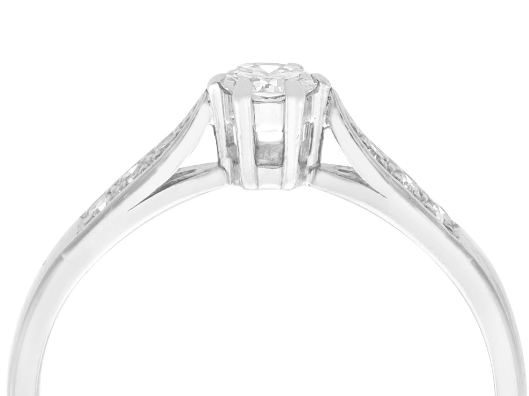 A fine and impressive 0.36 carat diamond and 18 karat white gold solitaire ring; part of our diamond jewelry/estate jewelry collections.

This impressive vintage solitaire diamond ring has been crafted in 18k white gold.

The pierced decorated