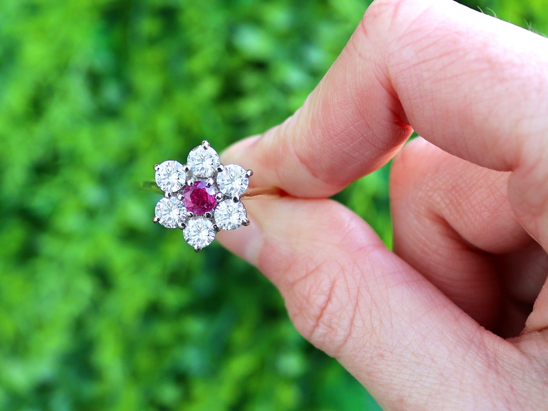 A stunning, fine and impressive vintage English 0.38 carat ruby and 2.46 carat diamond, 18 karat yellow gold flower cluster ring; part of our vintage jewellery and estate jewelry collections.

This stunning, fine and impressive vintage ruby ring has