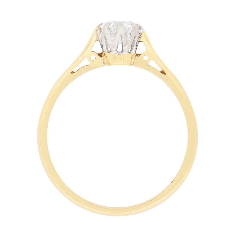A classic solitaire engagement ring which highlights a beautiful round brilliant diamond. It weighs 0.40 carat and and is graded I in colour, VS2 in clarity. It is claw set within an 18 carat white gold collet with an 18 carat yellow gold