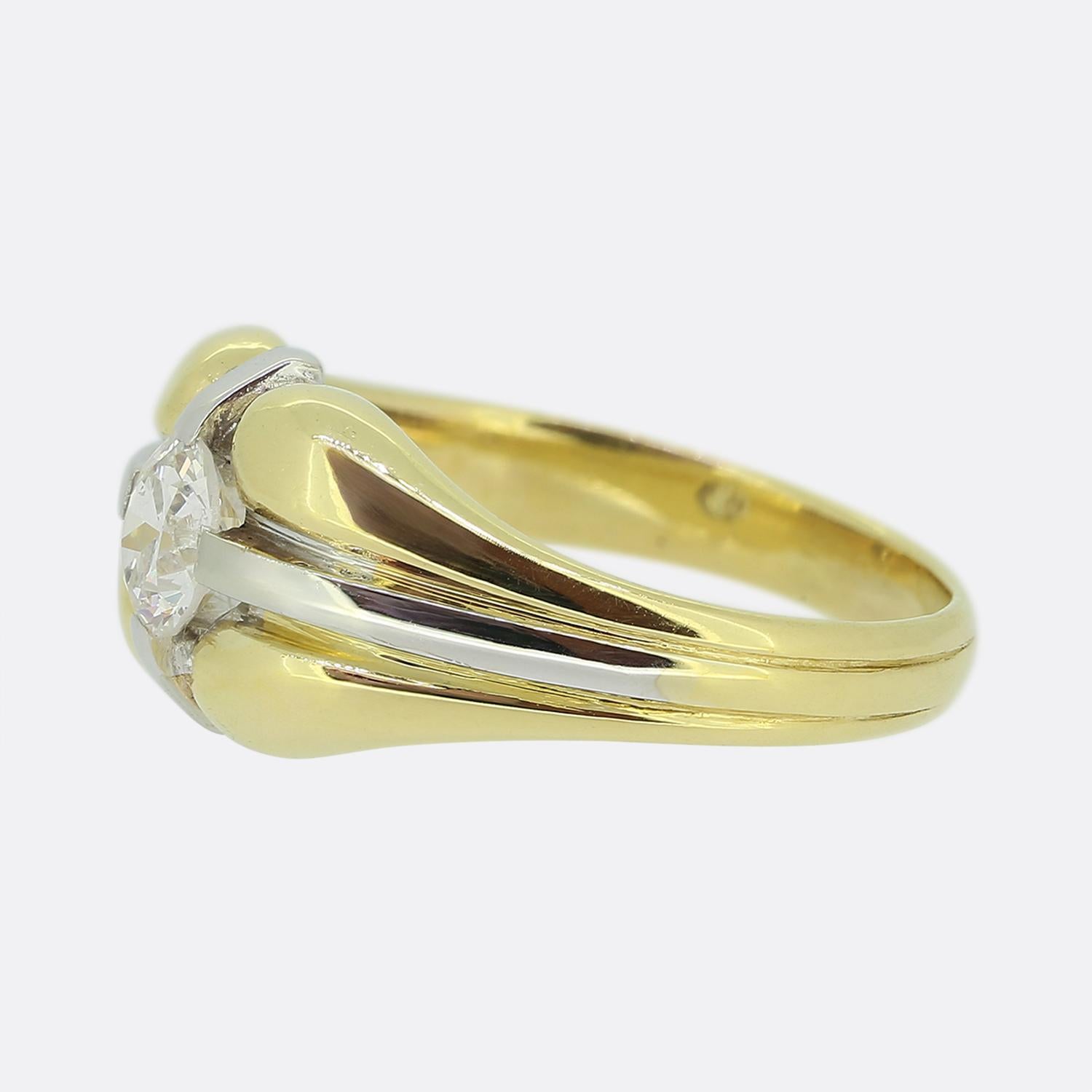 Here we have a wonderful single stone diamond ring. This vintage piece showcase a round faceted 0.45 carat old cut diamond at the centre of the face. This principal stone sits alone and proud atop a yellow gold bloated backdrop with a white gold