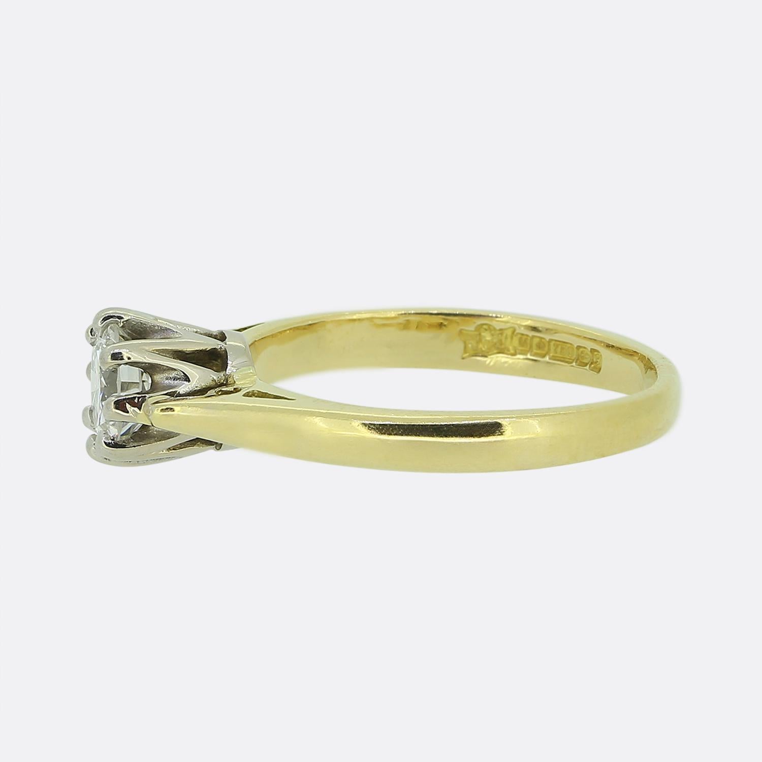 Here we have a charming diamond solitaire ring. This vintage piece showcases a single transitional cut diamond in an eight-clawed platinum setting which sits proud atop a plain 18ct yellow gold band. 

Condition: Used (Very Good)
Weight: 2.7