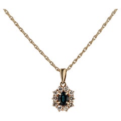 Retro 0.48 Carat Blue Sapphire and Diamond Halo Necklace