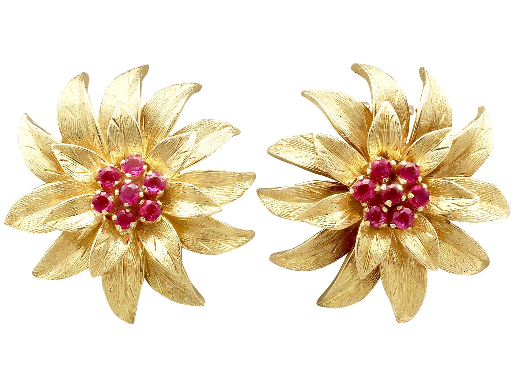 An impressive pair of vintage 0.48 carat ruby and 18 carat yellow gold floral earrings; part of our diverse gemstone jewelry collections.

These stunning, fine and impressive 18k yellow gold earrings have been modelled in the form of flowers.

Each
