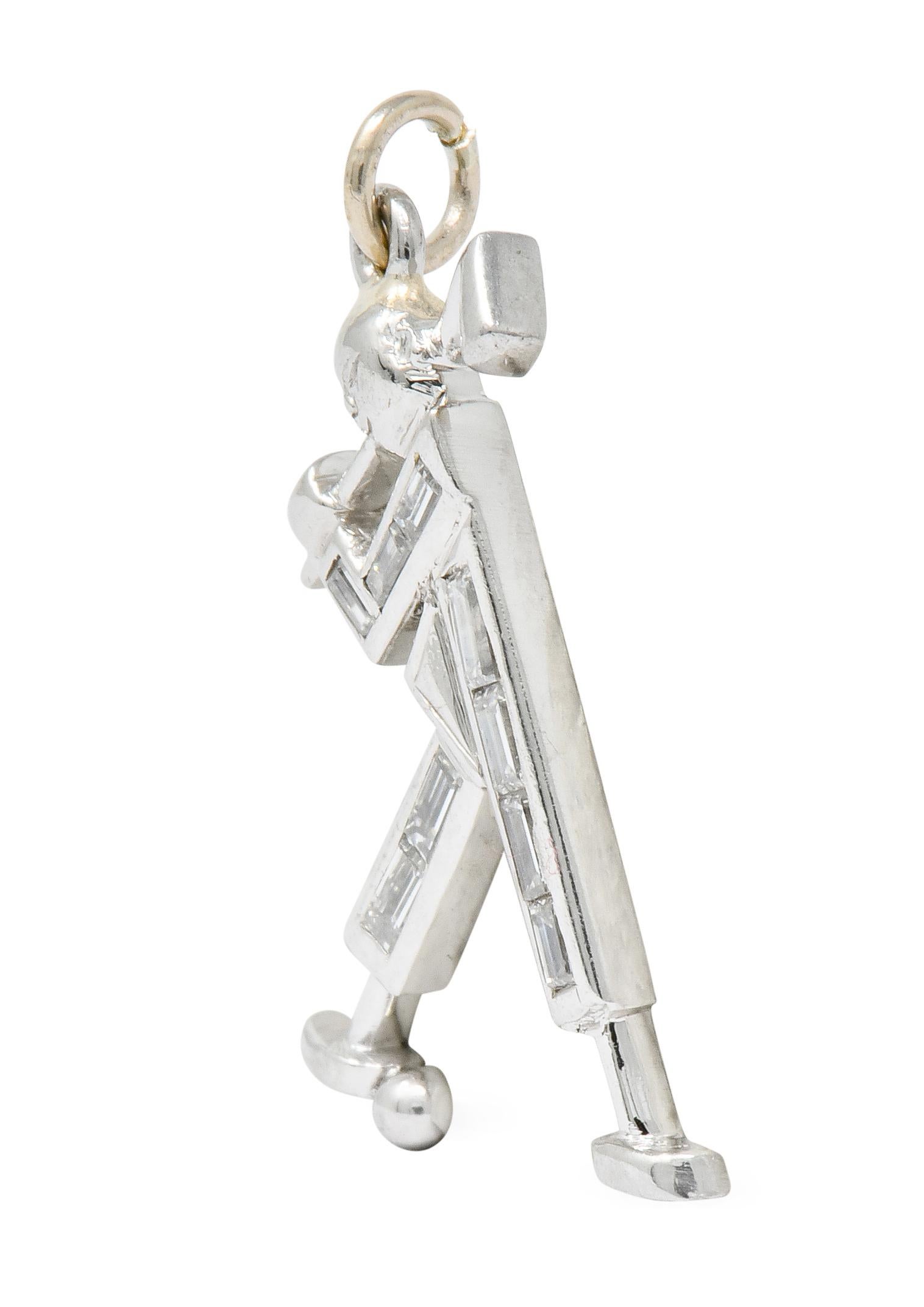 Charm designed as a stylized golfer, mid-swing

Limbs are comprised of bezel set baguette cut diamonds weighing approximately 0.50 carat total; eye-clean and white

Completed by jump ring bale

Tested as platinum

Circa: 1990s

Measures: 1/2 x 7/8