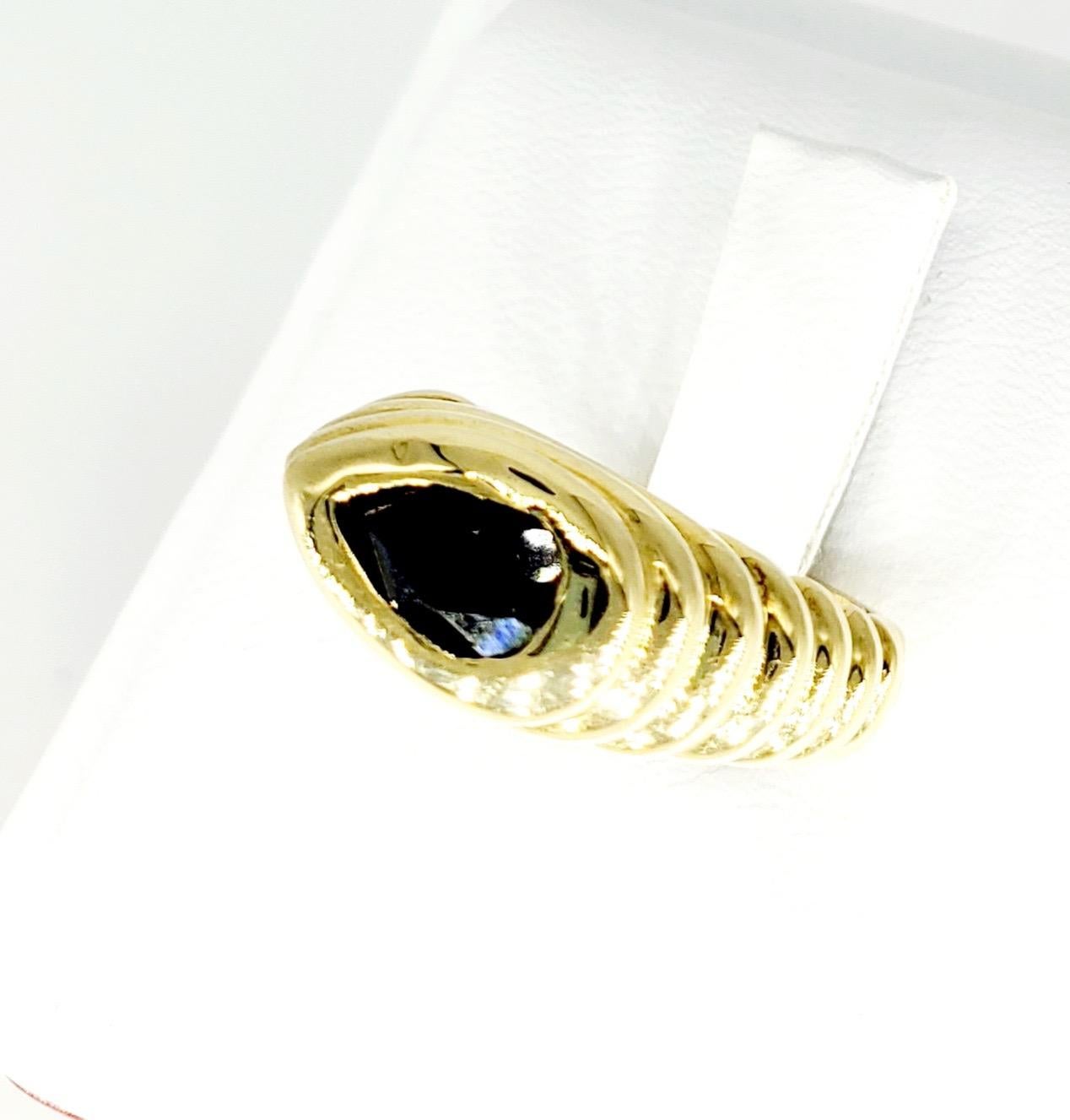 Vintage 0.50 Carat Dark Blue Pear Shape Sapphire 3D Bold design Ring. The ring weights 12.5 grams solid yellow gold 18k and is a size 6. The ring is very elegant, bold in design and heavy. Will surely stand out in the crowd.