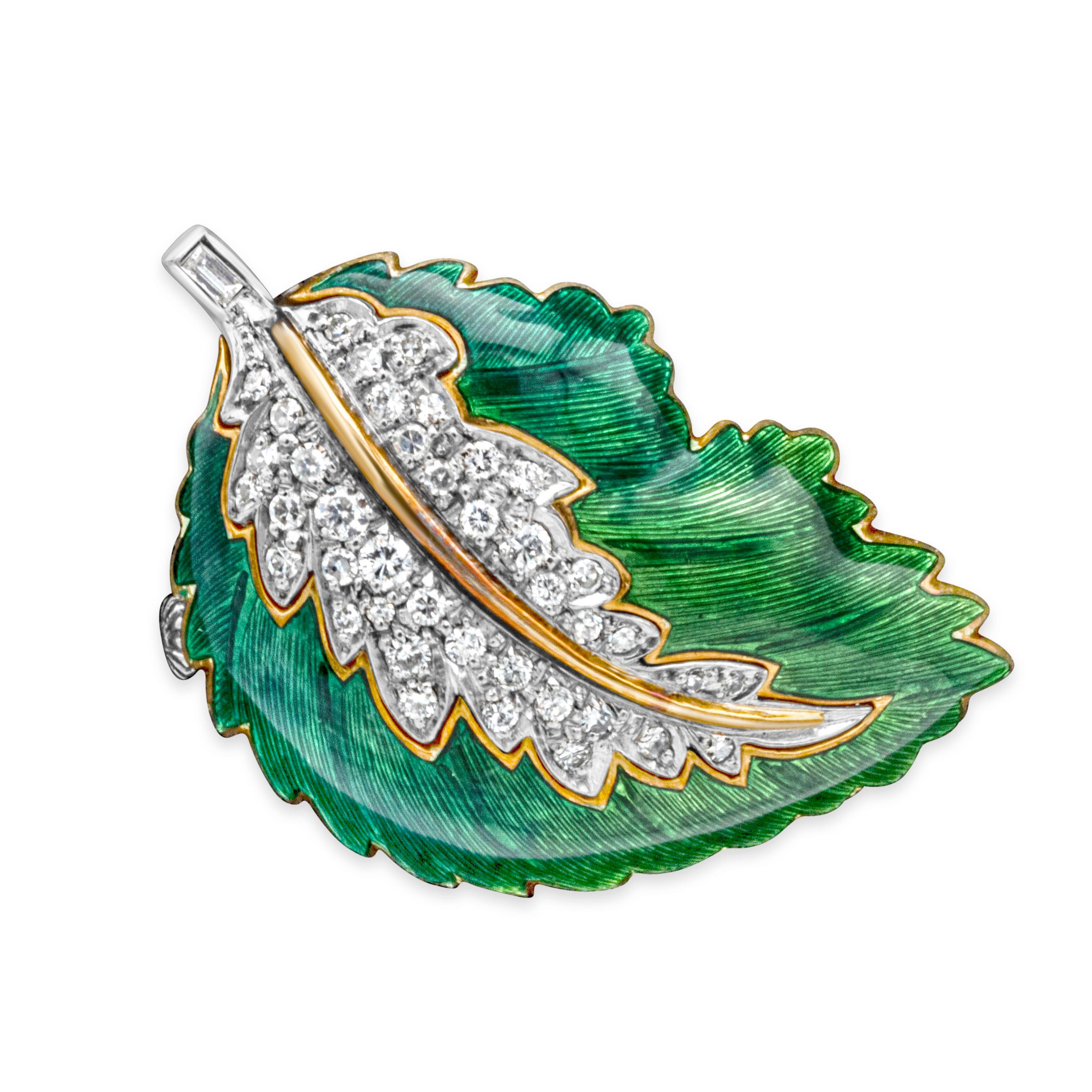 Showcasing a classic and beautiful brooch set in a green enamel leaf-like design and encrusted with 41 brilliant round diamonds, pave set weighing 0.50 carats total, F-G color and VS-SI in clarity. Perfectly made in 18k yellow gold and