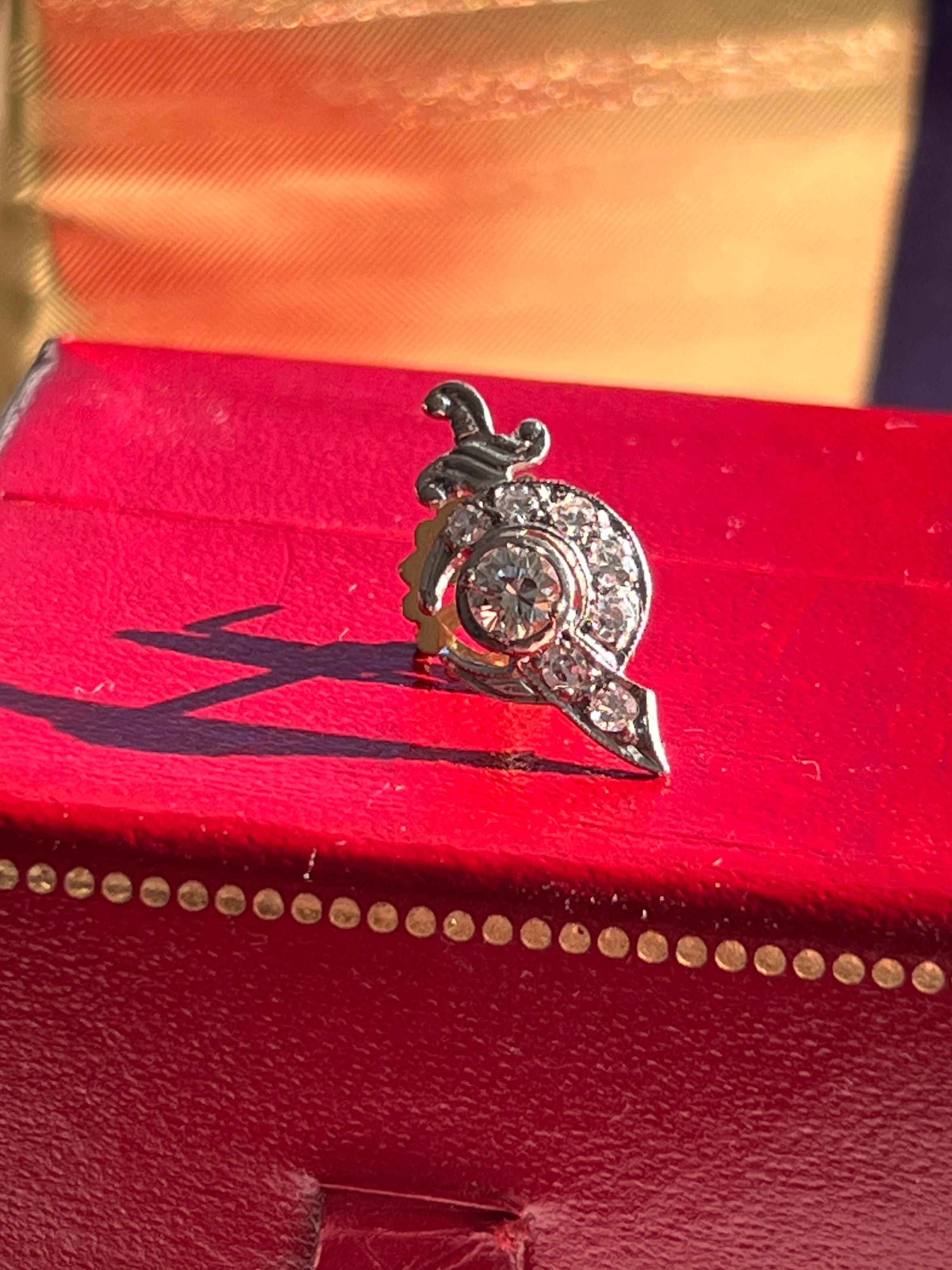 This estate 14K white and yellow gold Shriner's pin, stamped 14K and weighing 1.25 grams, features a total of 0.51 carats of diamonds. One round brilliant diamond (4.09mm, ~0.26 carat, H color, VS2 clarity) is complemented by seven round single-cut