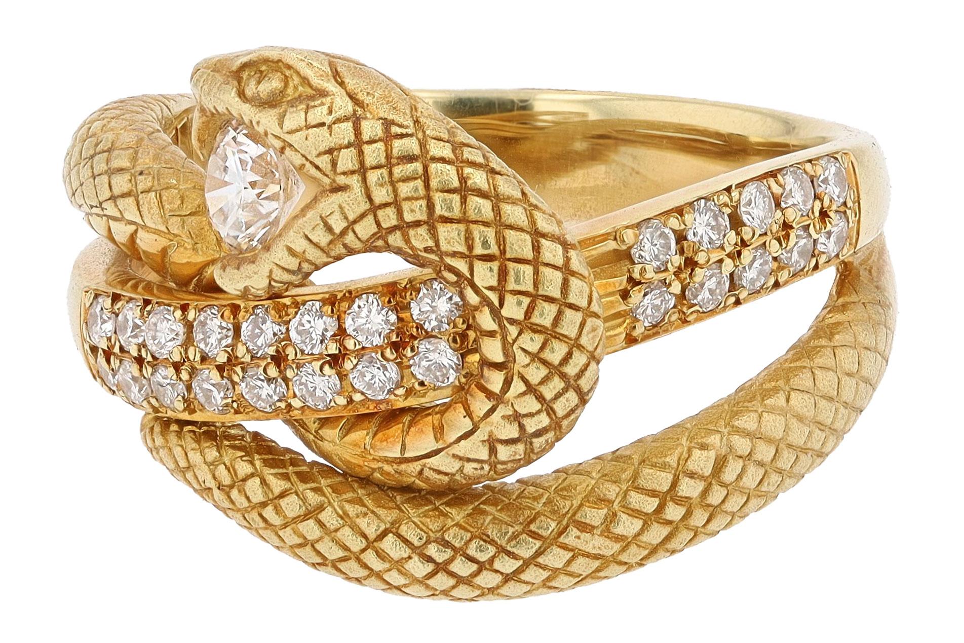 This highly engraved serpent wraps seductively around your finger while fiercely guarding the diamond in her mouth. Revered since ancient times, snake rings have been coveted as a talisman representing rebirth, wisdom and longevity. A staff