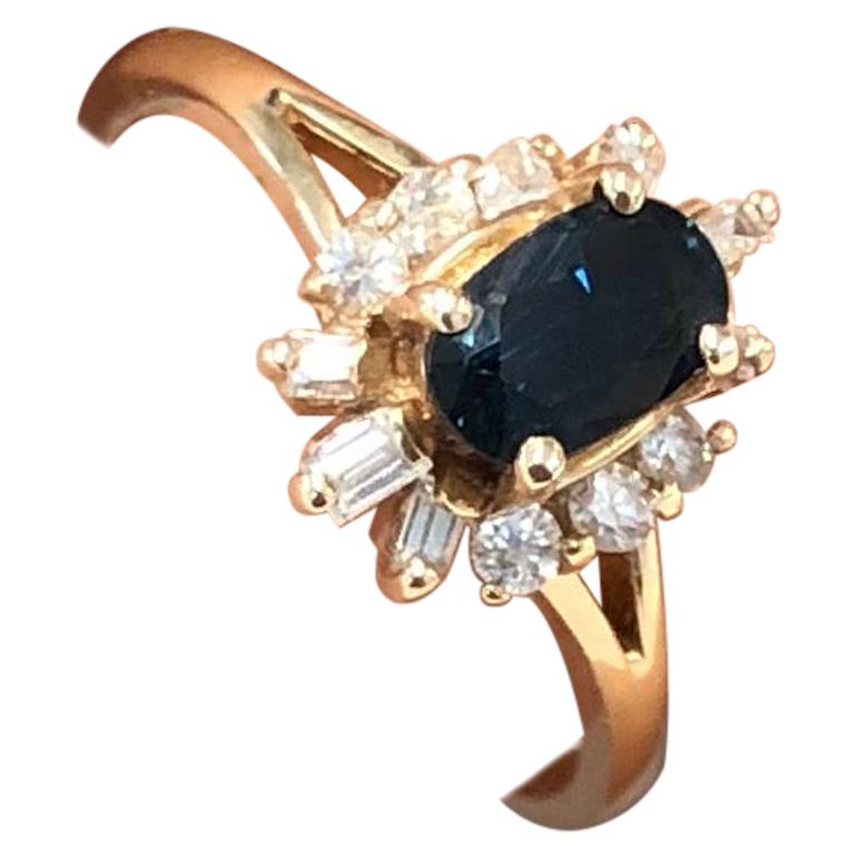 Vintage 0.59 Carat Oval Sapphire and Diamond Ring in 14 Karat Yellow Gold