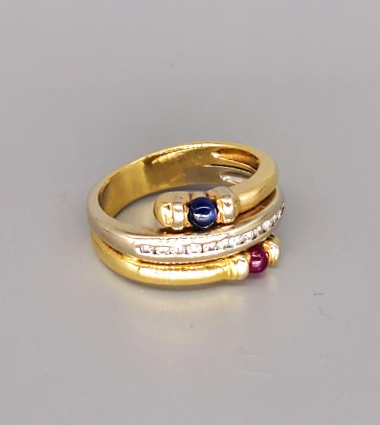 Vintage 0.60 Carats Diamonds & Sapphire Ruby Cabochon Ring. The diamonds weight approx 0.20 carats. The ruby & sapphire cabochon weight approx 0.20 carats each. The ring is made of 18k solid good and is also stamped 750 for purity. The ring is a