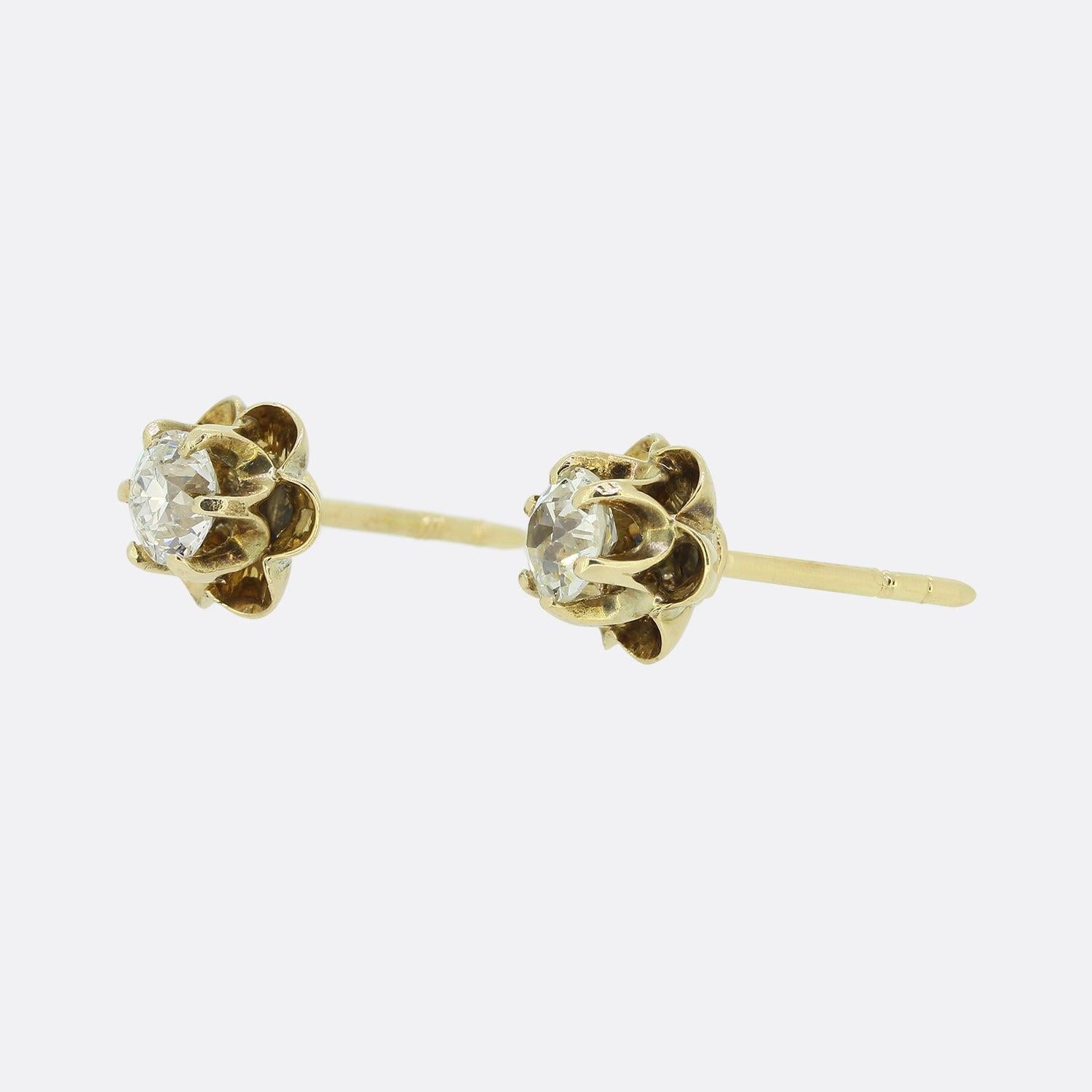 These are a pair of vintage 18ct yellow gold diamond stud earrings. Each earring has been crafted into the shape of a flower head and is set with a 0.30 carat old cut diamond within a 6 clawed mount. 


Condition: Used (Very Good)
Weight: 1.9