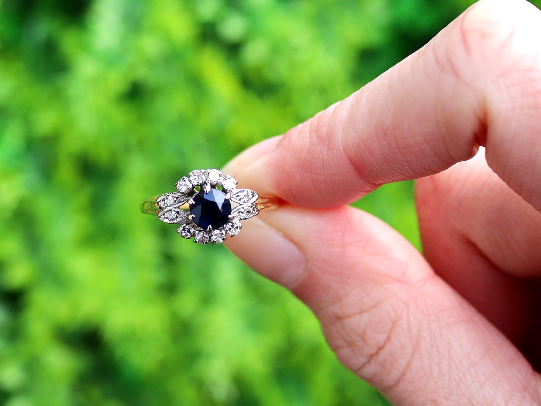 A very good 0.60 carat natural sapphire and 0.22 carat diamond, 18 karat yellow gold, platinum set cluster ring; part of our vintage jewellery and estate jewelry collections.

This impressive vintage dress ring has been crafted in 18k yellow gold