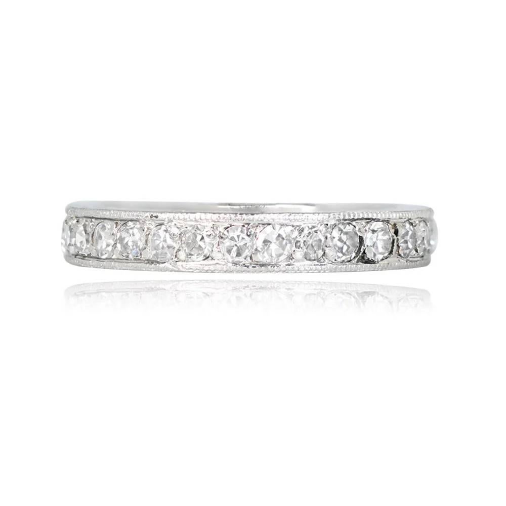 A vintage Art Deco era platinum eternity band, circa 1930, features pave-set antique single-cut diamonds with a total weight of approximately 0.67 carats. The intricately hand-engraved sides add a decorative touch to this handcrafted piece.

Ring