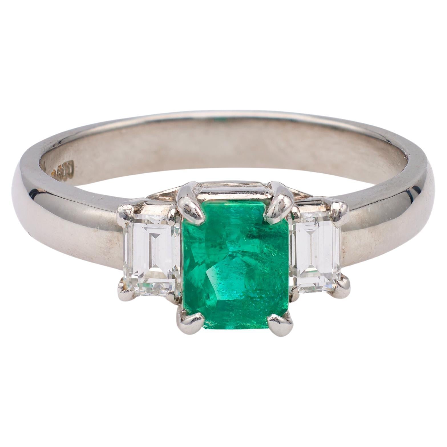 Vintage 0.69 Carat Emerald and Diamond Platinum Three Stone Ring