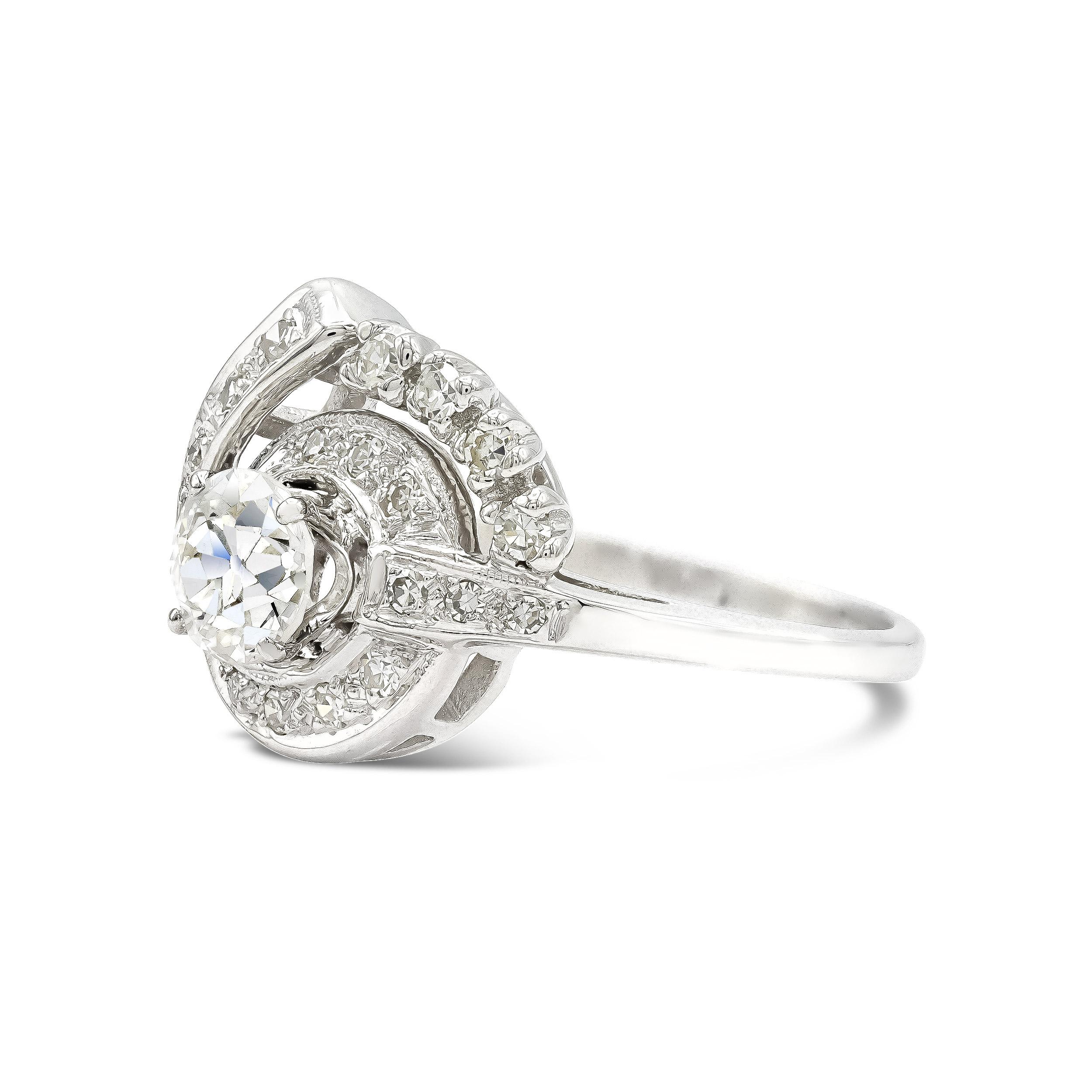 Here's a uniquely designed engagement with the kind of style and jazz you would only find with a vintage piece. Centered with an enticing 0.72 carat old European cut among a sea of single cut diamond accents this ring really sparkles.

Diamond