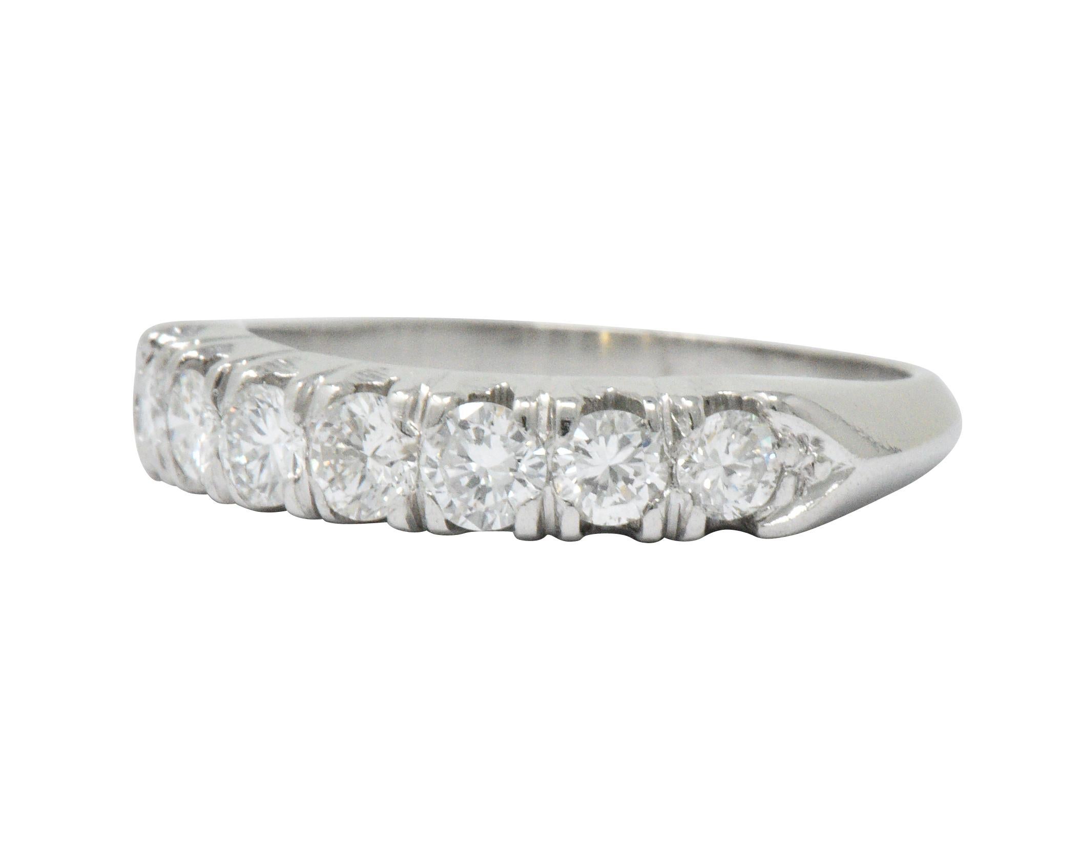 Set to the front with 7 round brilliant cut diamonds weighing approximately 0.75 carats total, G/H color and VS to SI clarity

Prong set with a lovely tapered knife-edge shank for a comfortable profile

Nice stack ring

Ring Size: 7 1/4 &