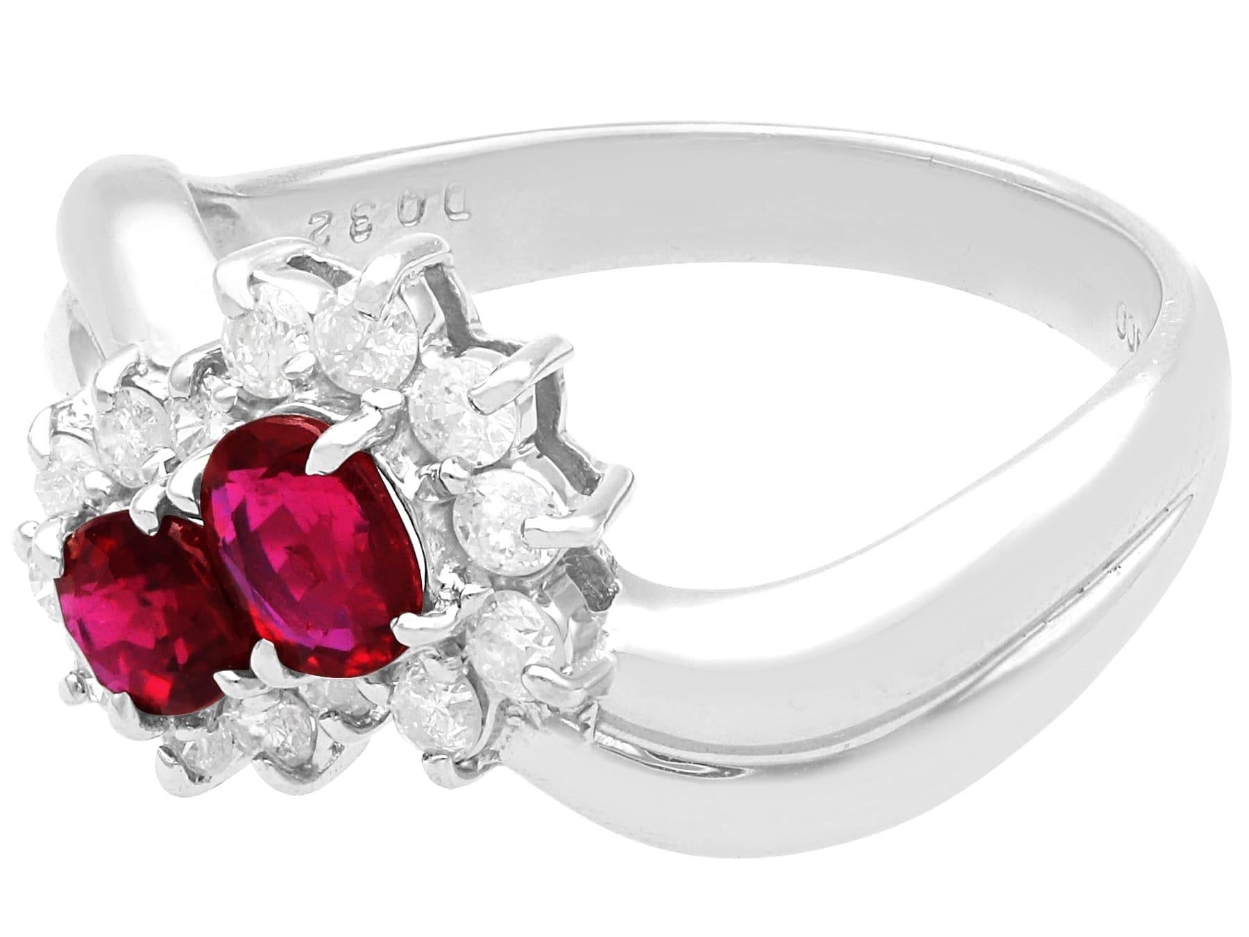 Oval Cut Vintage 0.76ct Ruby and 0.32ct Diamond Platinum Cluster Ring, circa 1990 For Sale