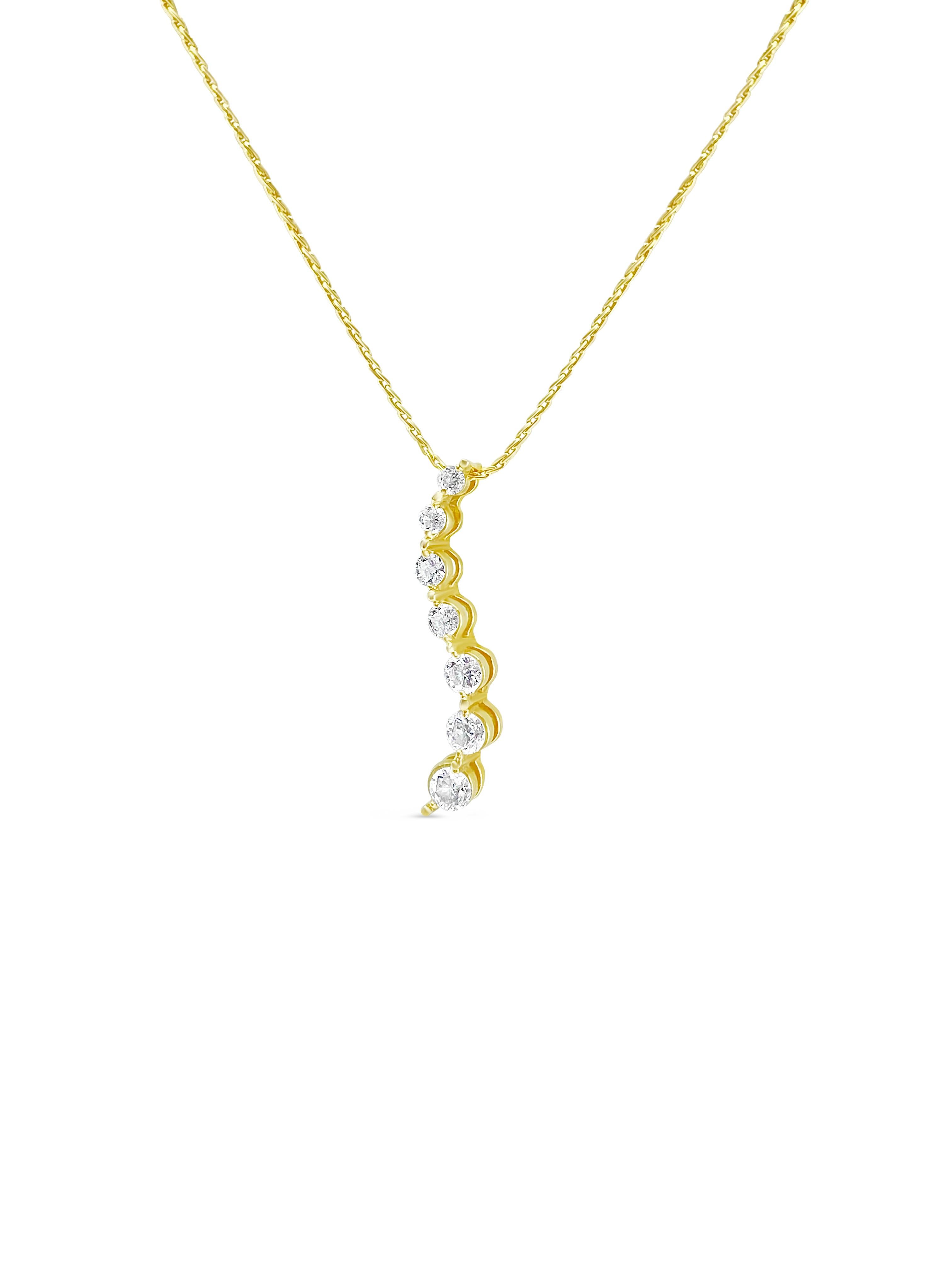 Crafted from 14k yellow gold, this elegant pendant necklace features a total of 0.80 carats of natural earth-mined diamonds. With VS clarity and F-G color, the diamonds exhibit exceptional brilliance and quality. The pendant comes with a 20