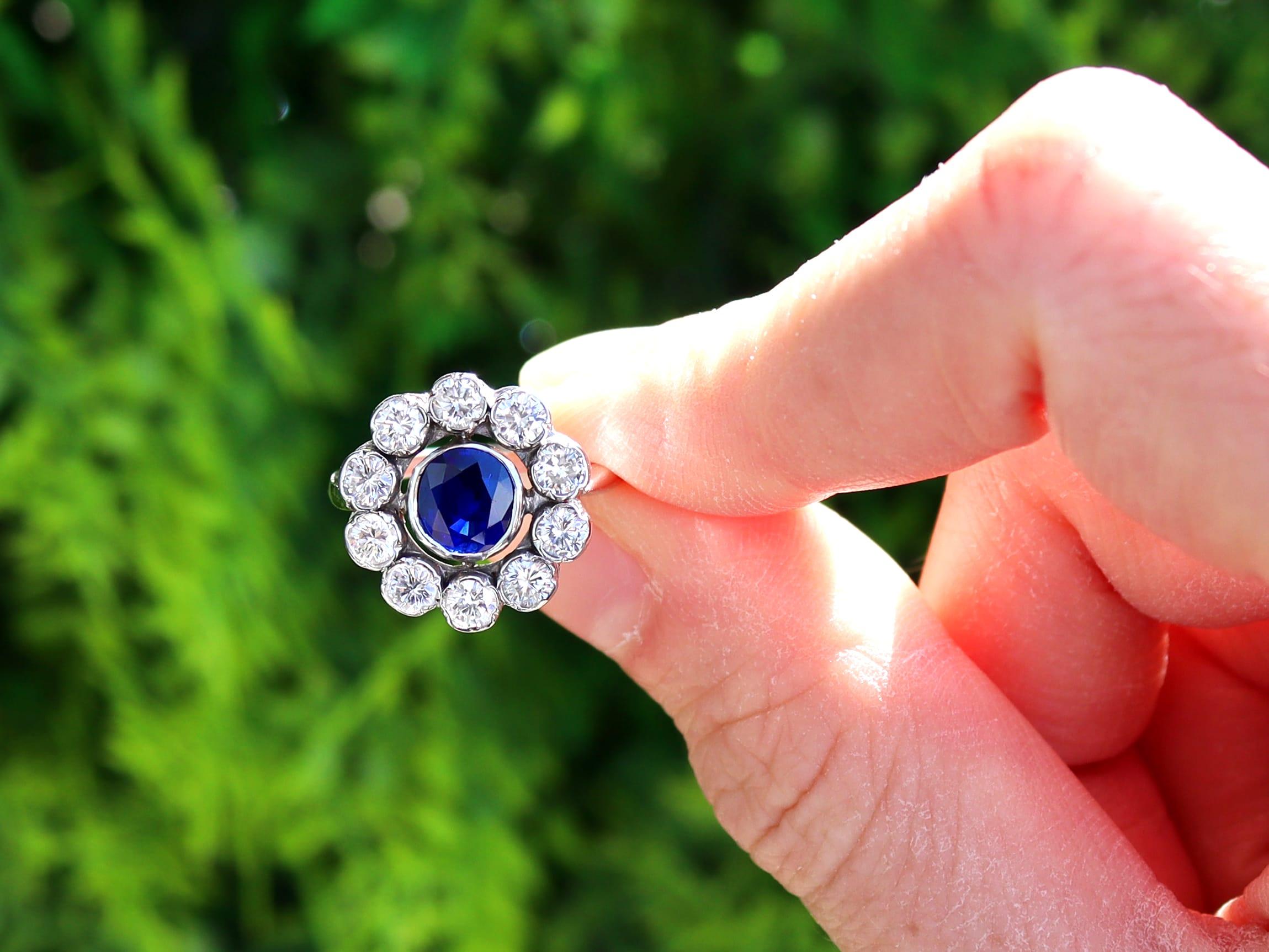A stunning, fine and impressive 0.82 carat natural blue sapphire and 0.65 carat diamond (total), 18 karat white gold cluster ring; part of our vintage sapphire jewellery collections.

This stunning, fine and impressive vintage sapphire ring has been