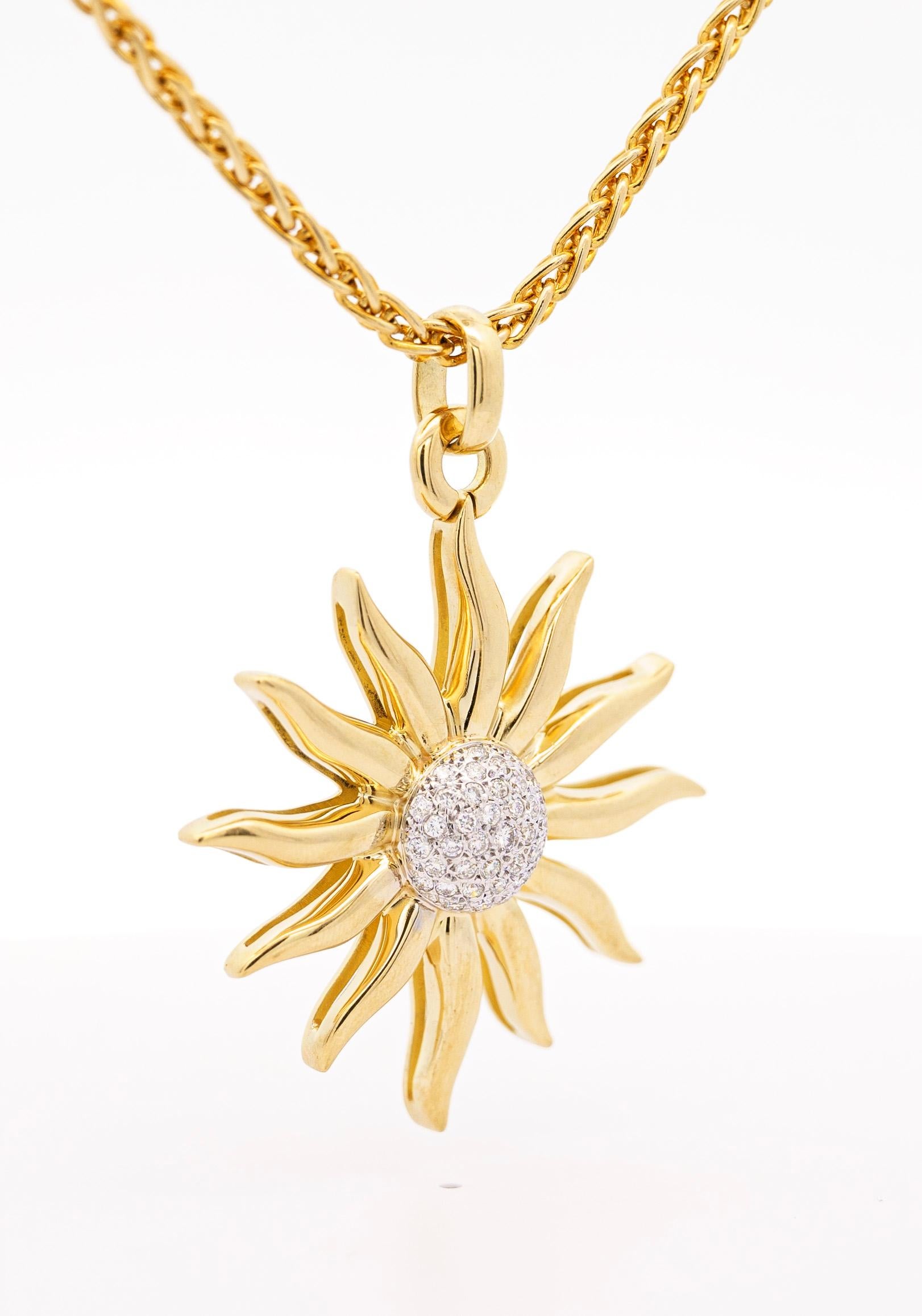 Vintage 0.85 carat sun motif diamond pendant necklace. The pendant is crafted in 18k yellow gold with stunning white round cut diamonds bezel set in the middle of the sun. The chain of the necklace is 18 inches and pendant weighs 26.8 grams.