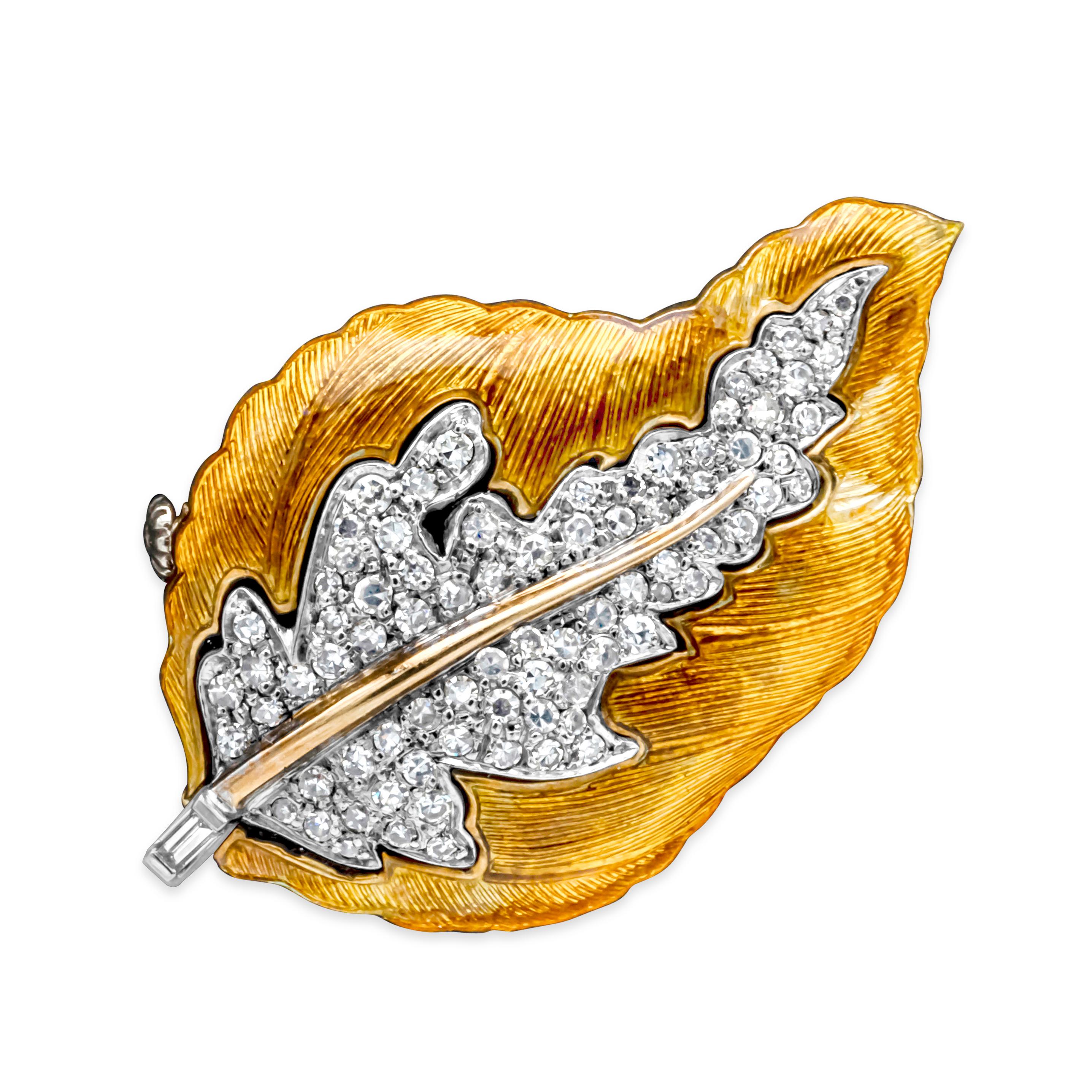 Showcasing a classic and color-rich brooch set in a leaf-like design and encrusted with 80 brilliant round diamonds, pave set weighing 0.85 carats total, F-G color and VS-SI in clarity. The entire leaf is mix of yellowish and orange enamel inlays