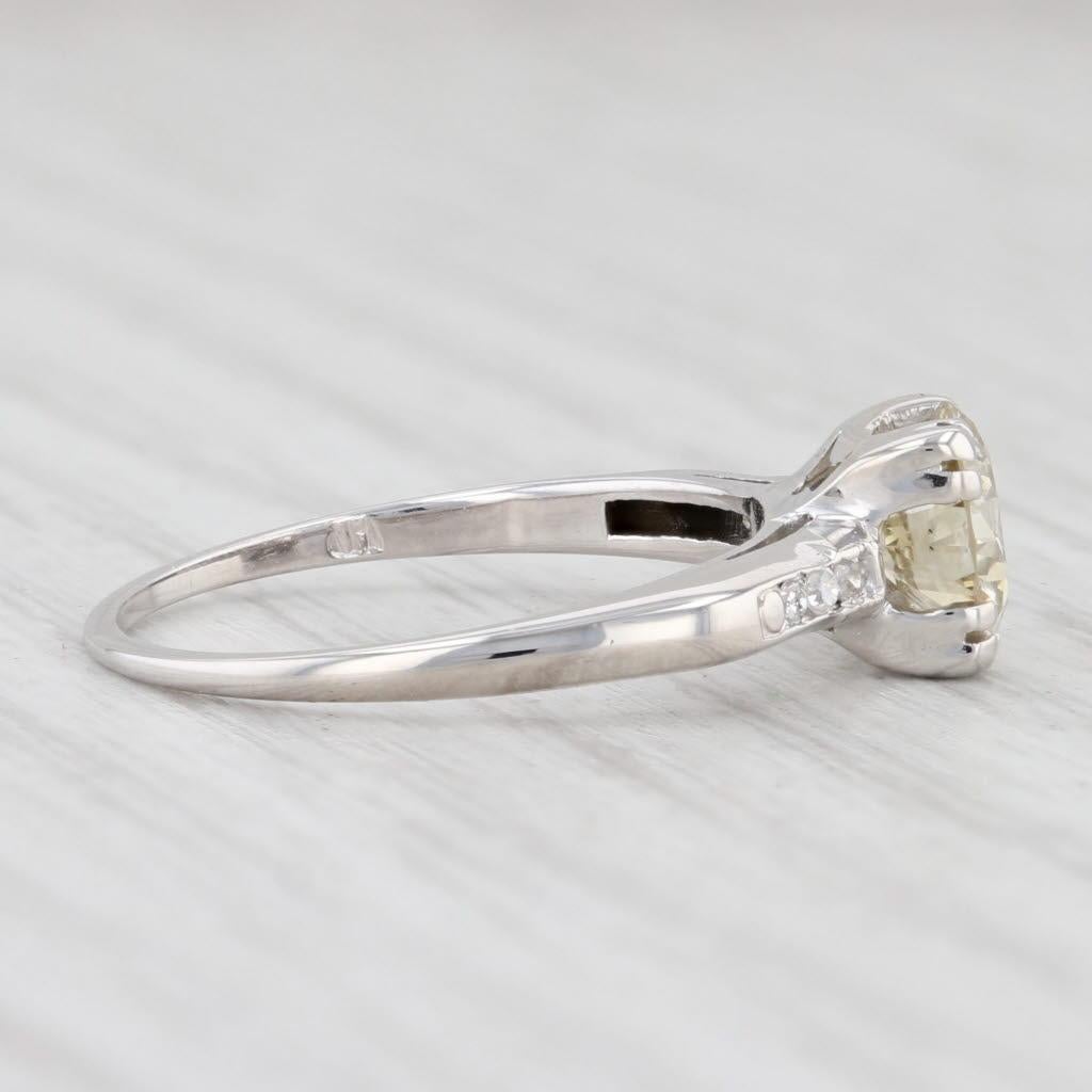 Gem: Natural Diamonds - 0.88 Total Carats
- Center - 0.84 Carats, Round Brilliant Cut, Light Yellow Brown Color, VS2 Clarity
- Sides - 0.04 Total Carats, Single Cut, G - H Color, VS2 Clarity
Metal: 14k White Gold
Weight: 1.8 Grams 
Stamps: 14k
Face