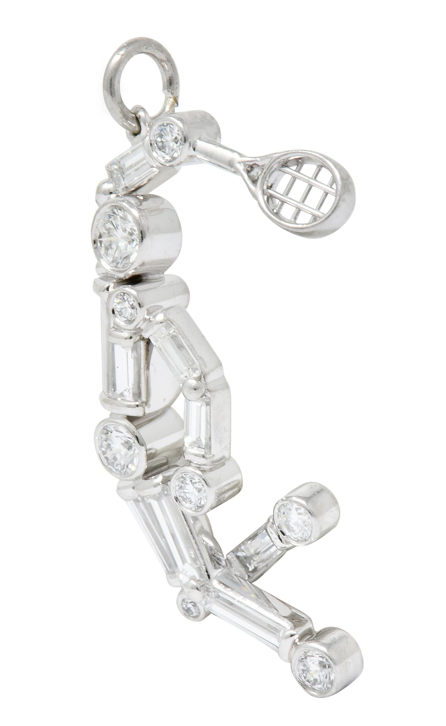 Charm designed as a stylized tennis player mid-jump weilding a racket

Figure is comprised of bezel set round brilliant and baguette cut diamonds weighing approximately 0.90 carat, F/G color and VS clarity

Completed by jump ring bale

Numbered with