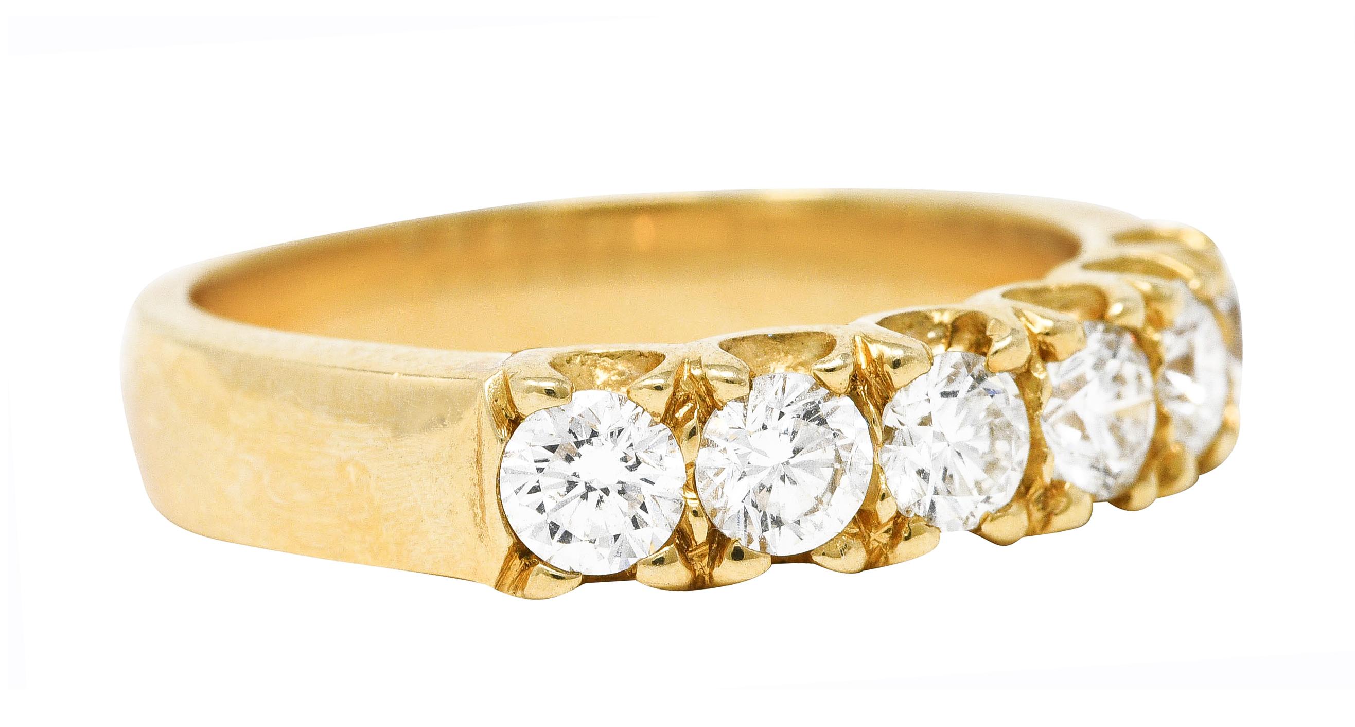 Band ring features six round brilliant cut diamonds prong set to front

Weighing approximately 0.90 carat - F in color with VS clarity

Featuring a fishtail profile

Stamped 14k for 14 karat gold

With maker's mark for Leo Ingwer

Circa: