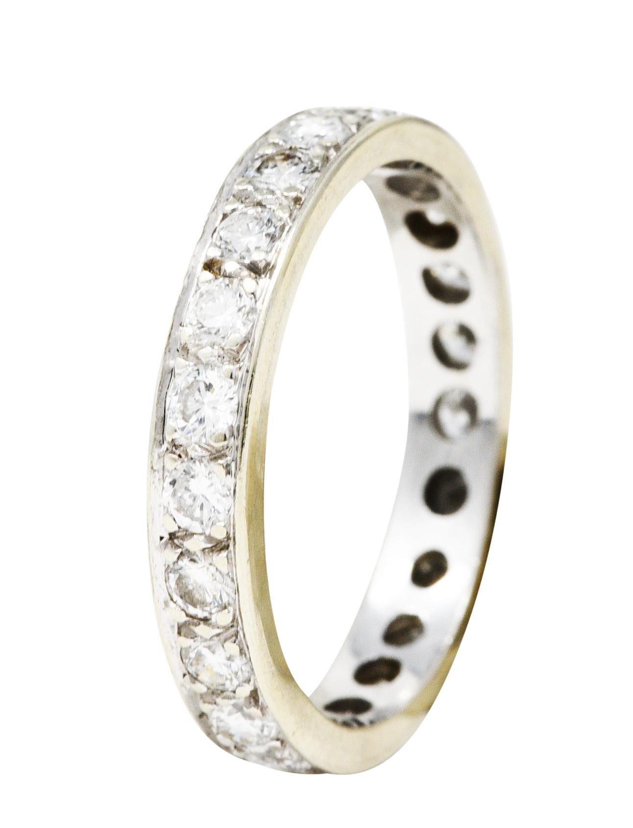 Band ring features round brilliant cut diamonds bead set fully around. Weighing approximately 0.92 carat total - G/H color with VS1 clarity. Tested as 14 karat white gold. Circa: 20th century. Ring size: 5 1/4 and not sizable. Measures: North to