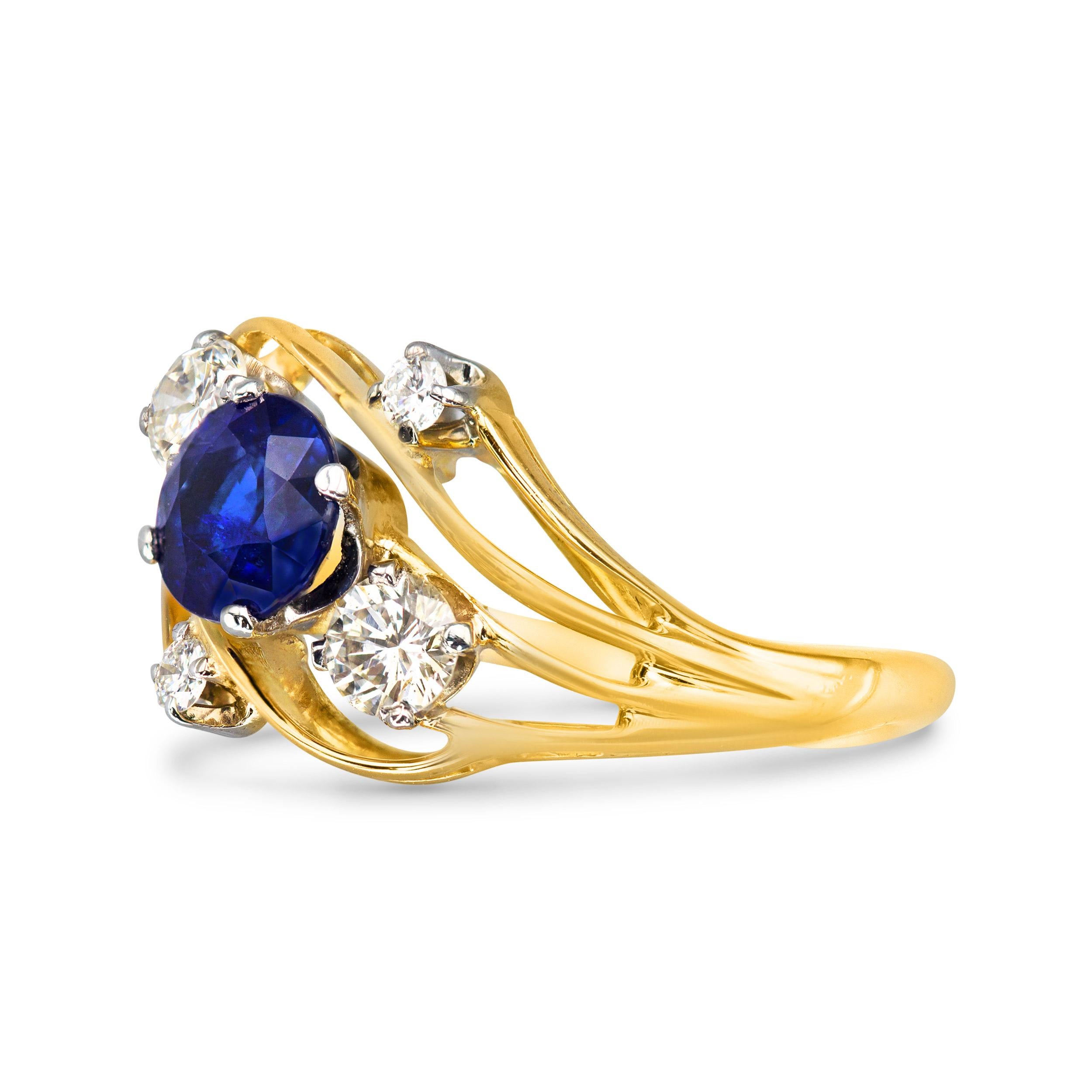 Blue, white, and yellow gold... just a few of my favorite things. This vintage number is the perfect ring to add to your everyday stack. The center 0.97 carat sapphire is complemented by four sweet little single-cut diamonds. An all-around fun and