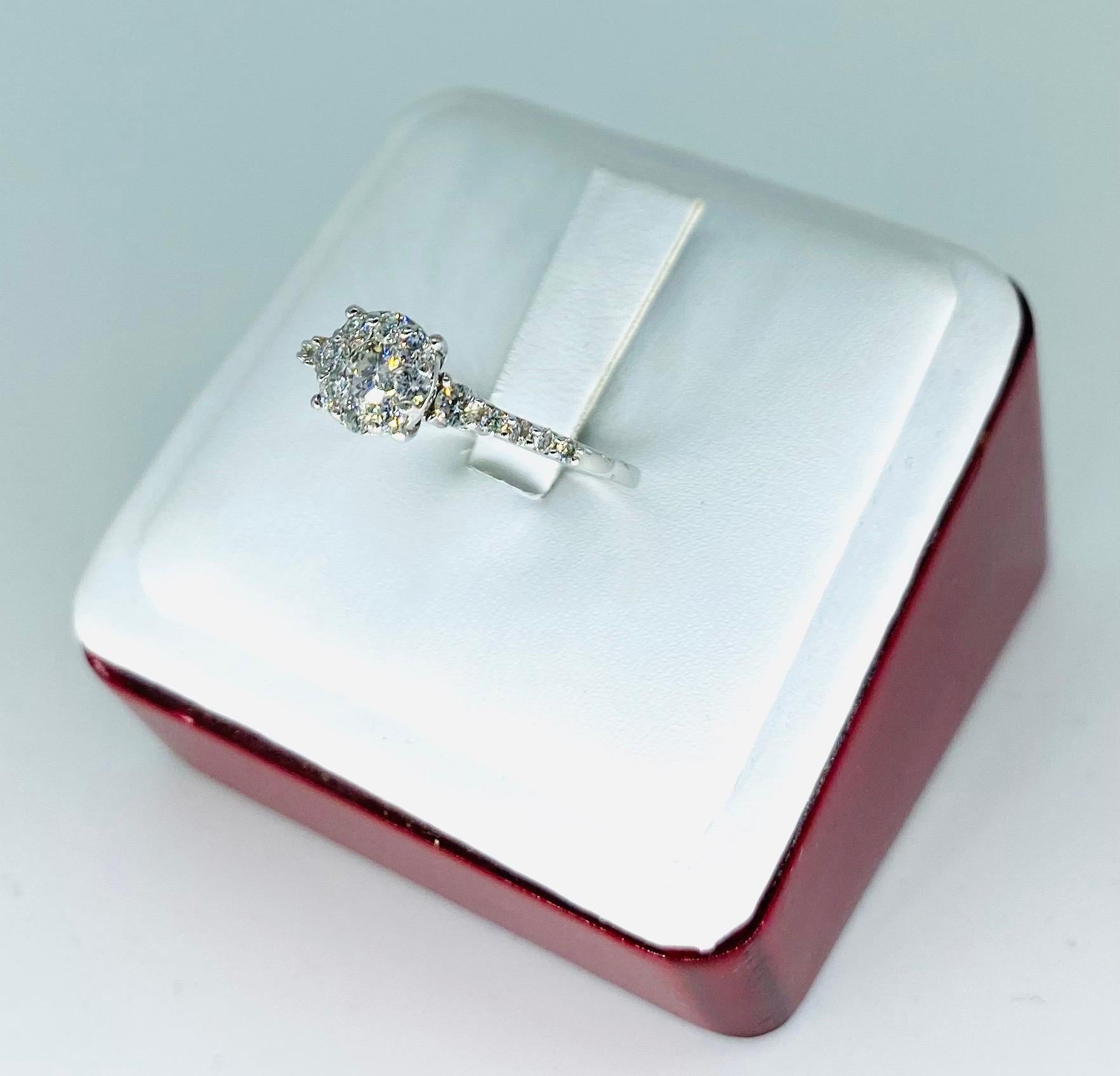 Vintage 1 Carat Diamonds Halo Engagement Ring 14k White Gold. The ring is very impressive with a designer with PAT # and stamped 14k. Very quality quality diamokds making sure they sparkle when light hits. The total amount of diamonds in weight is