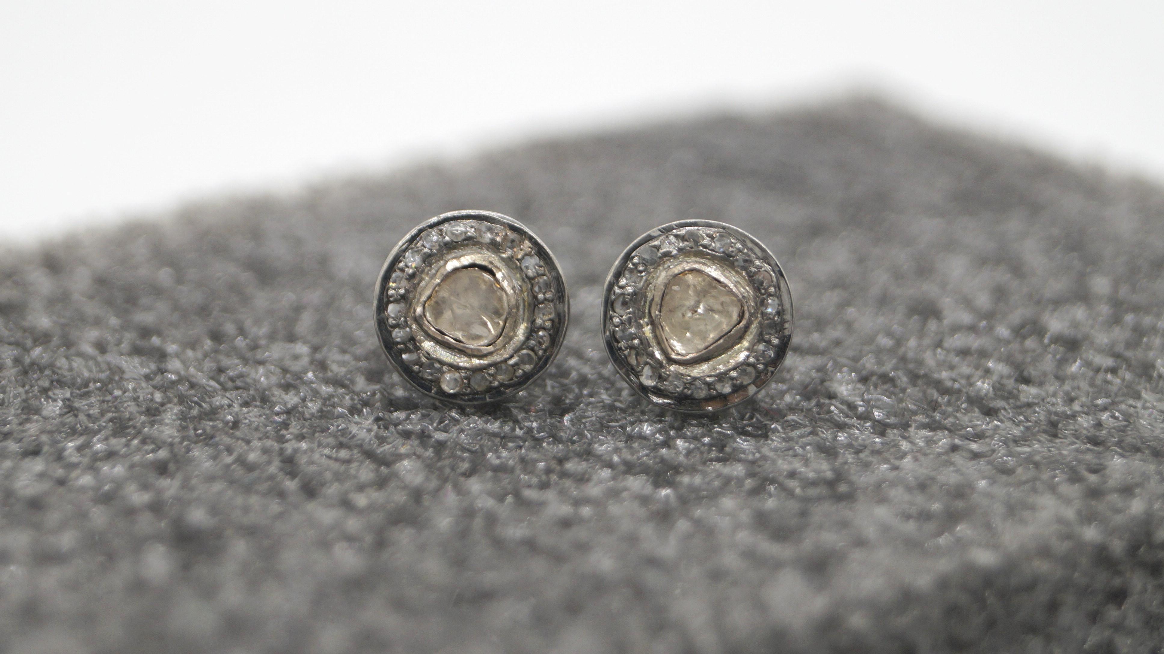 This pair of earrings have natural real diamonds. It is made up of sterling silver. It comes with a certificate of authenticity.
