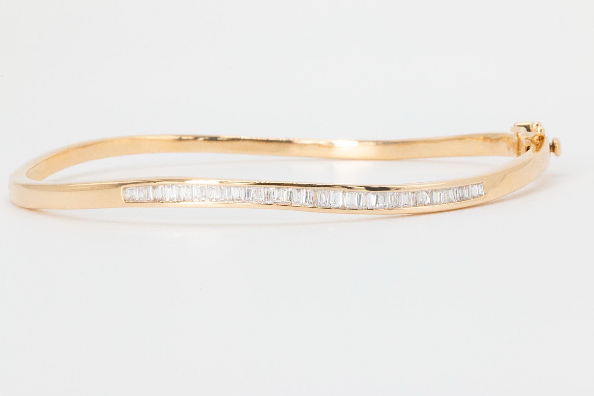 Vintage 1 CTW Baguette Cut Diamond Bangle in 14K Yellow Gold

Sophisticated and timeless, this vintage 14K yellow gold bangle is adorned with baguette cut natural diamonds channel-set across the top for a sleek, continuous sparkle. With an