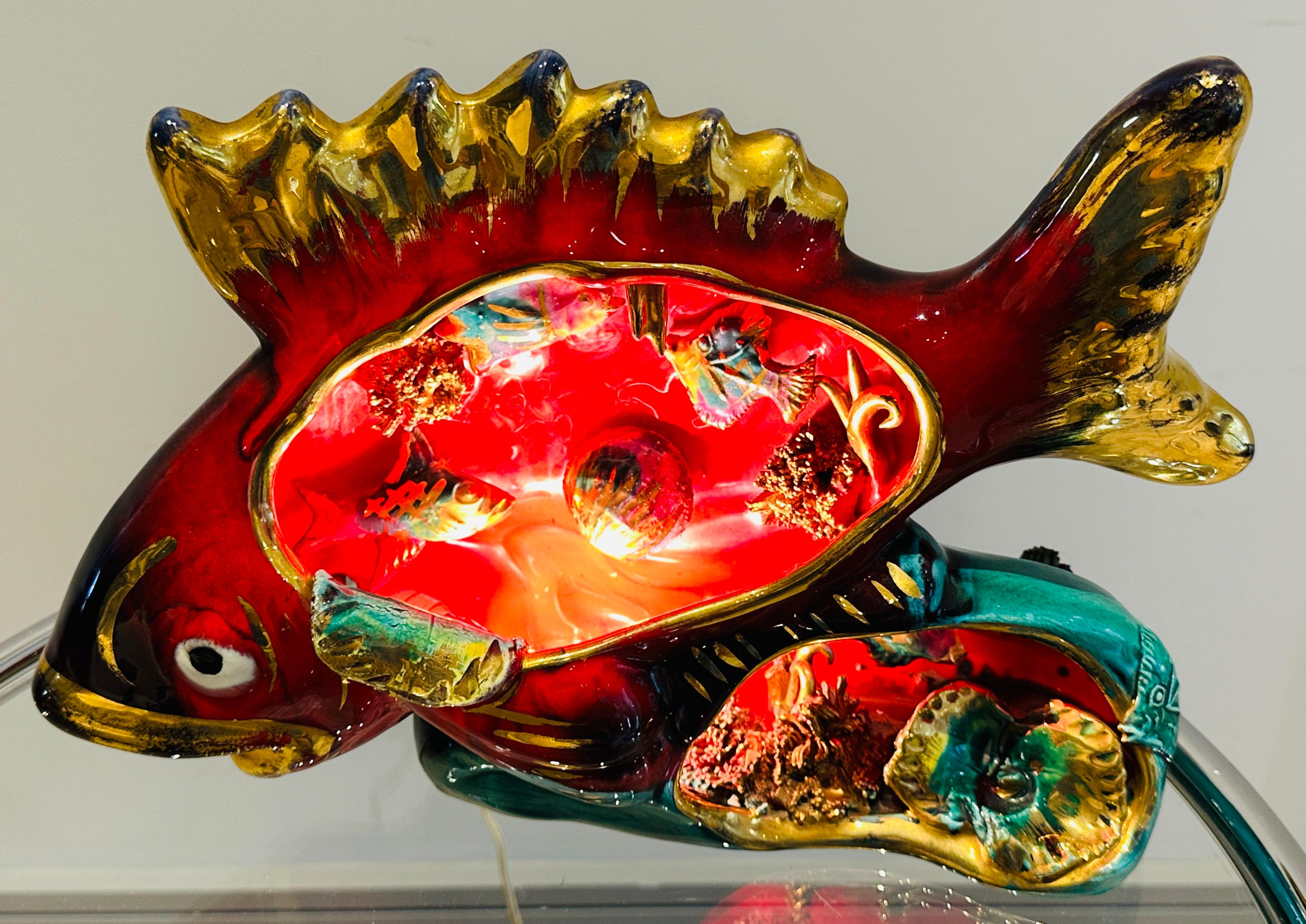 Vintage table lamp made of brightly painted and shiny glazed ceramic in the shape of a fish, produced in Vallauris, France, most likely during the 1950s or 1960s. These types of 