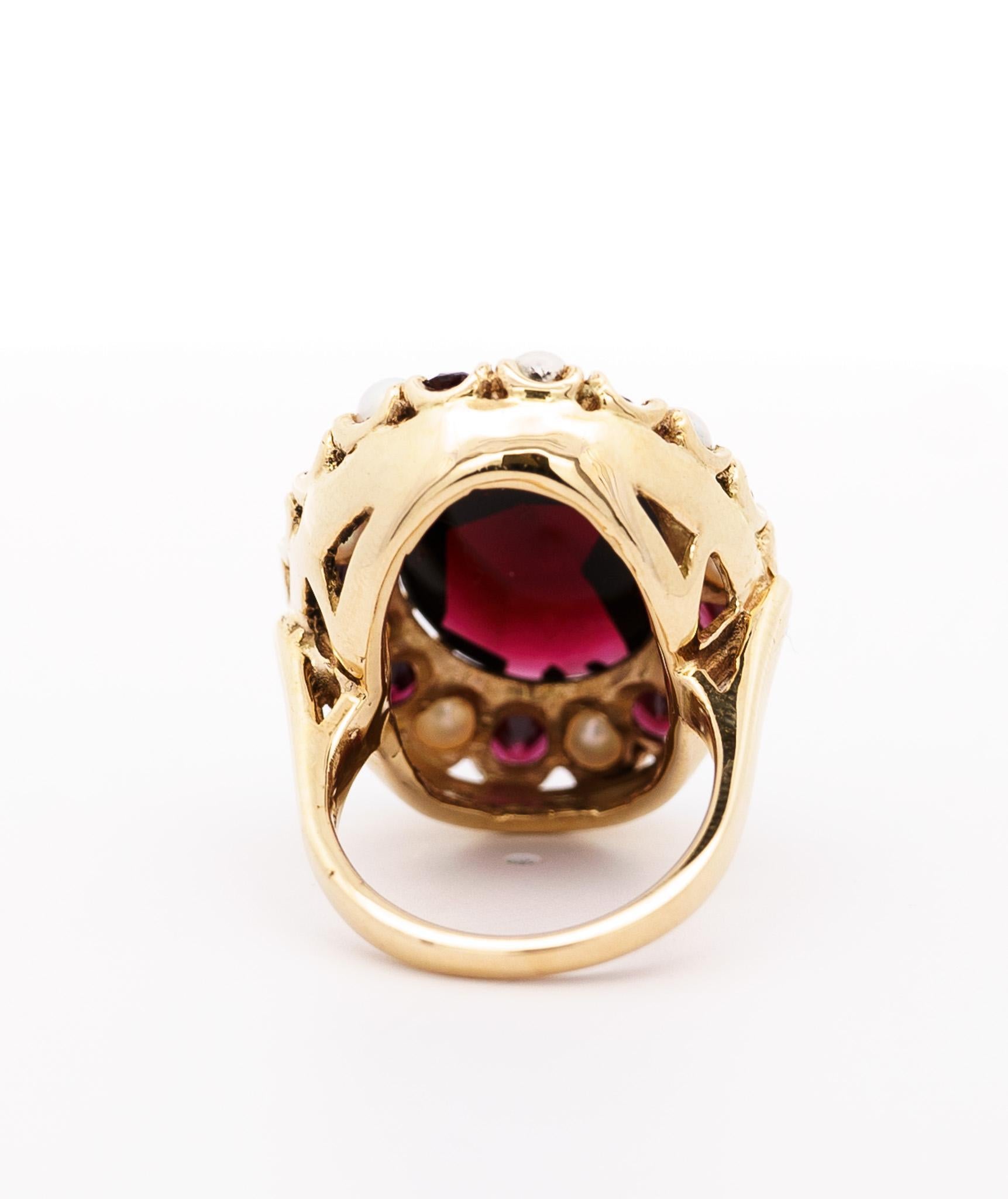 Art Nouveau Vintage 10 Carat Oval Cut Garnet and Pearl Halo 14K Yellow Gold Cocktail Ring For Sale