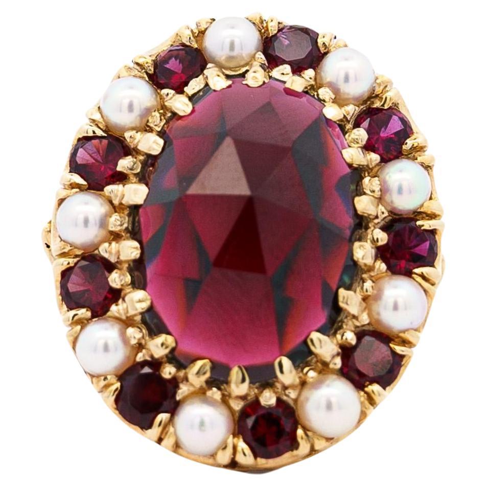 Vintage 10 Carat Oval Cut Garnet and Pearl Halo 14K Yellow Gold Cocktail Ring For Sale