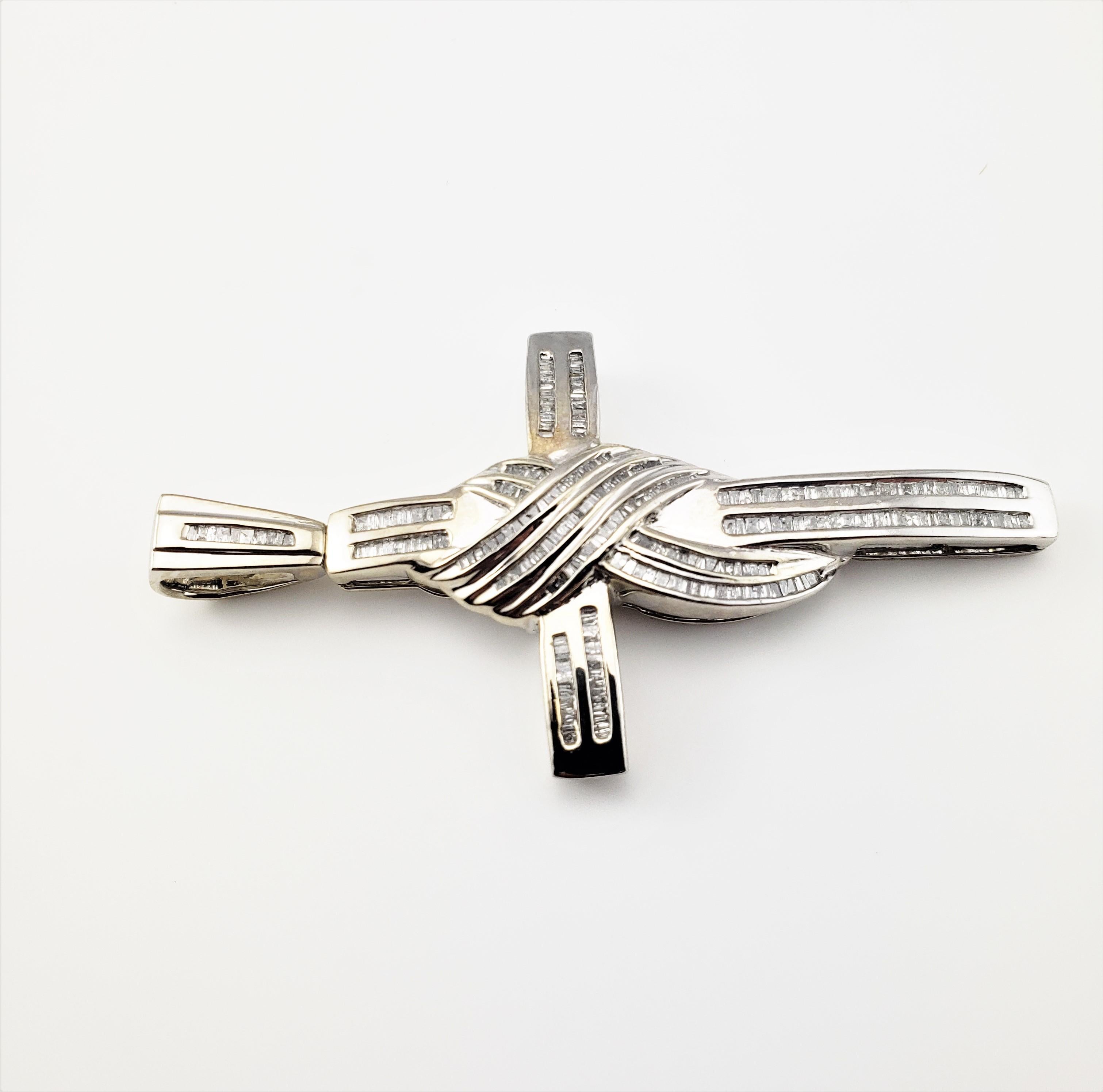 Vintage 10 Karat White Gold and Diamond Cross Pendant-

This stunning cross pendant features 243 baguette diamonds set in beautifully detailed 10K white gold.

Approximate total diamond weight: 1.75 cts.

Diamond color: I

Diamond clarity: