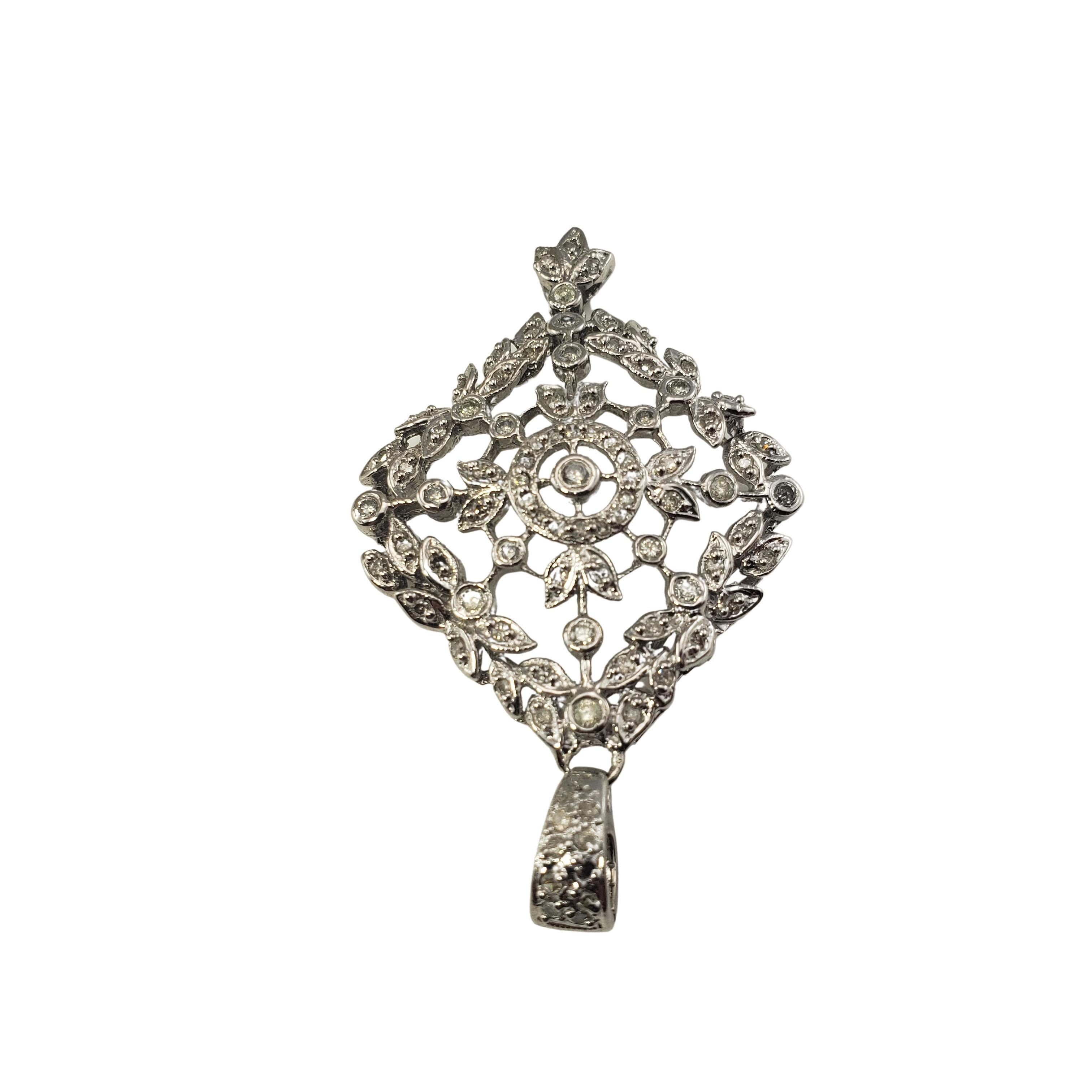 Vintage 10 Karat White Gold and Diamond Floral Pendant-

This sparkling pendant features 93 round brilliant cut diamonds set in classic 10K white gold.

Approximate total diamond weight:  .75 ct.

Diamond color: H-K

Diamond clarity: I1-I3

Size: 46